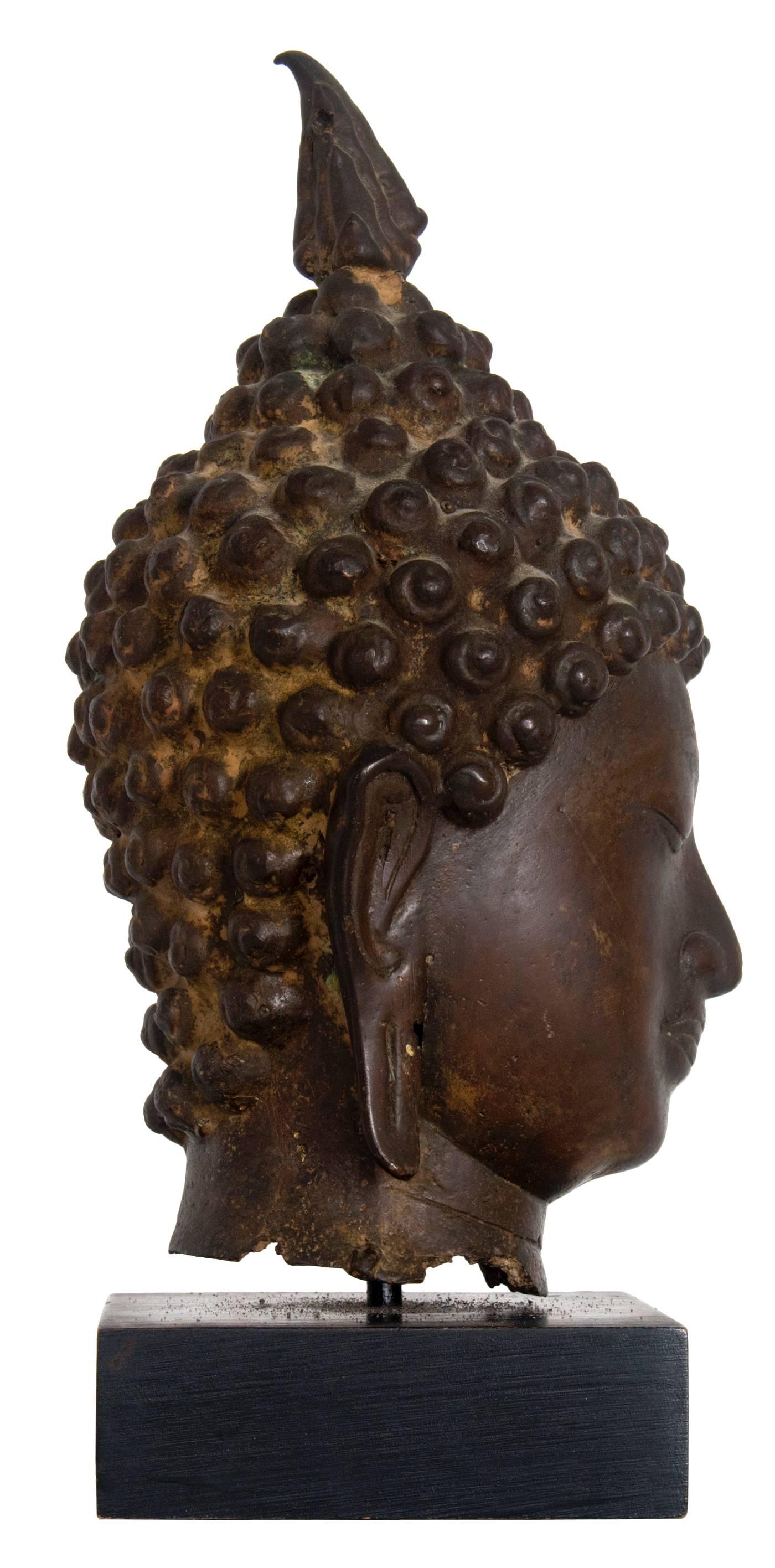 Bronze Buddha head, probably Thailand, circa 1900.
Height of head without base is 9