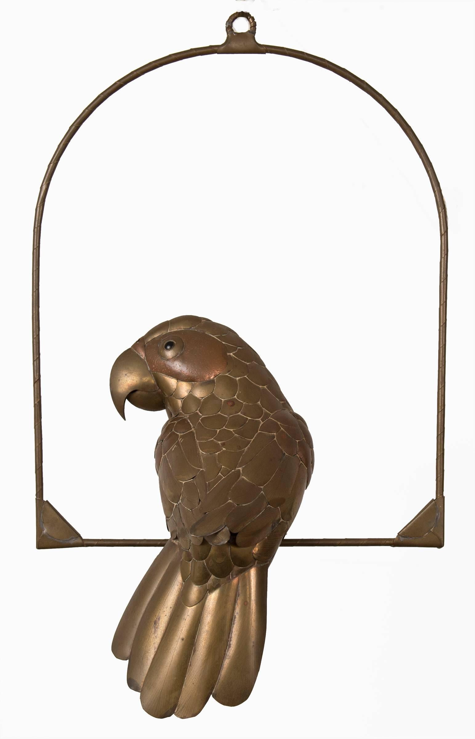 Sergio Bustamante hanging perched parrot. Mixed metal sculpture in excellent condition.