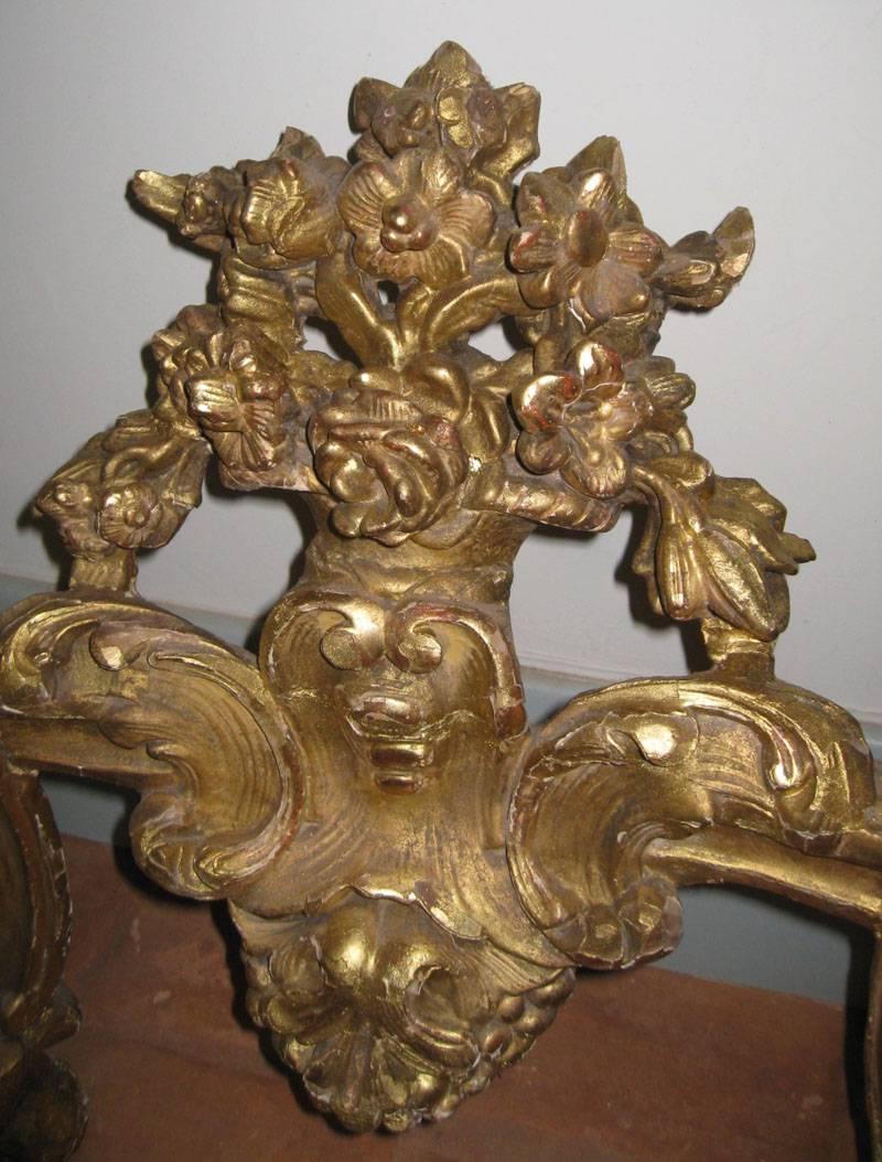 Exceptional carved wood console.
Original marble top.
Louis XV, with Rococo influence
giltwood over Rouge Royal.
Wall-mounted,
18th century, French.