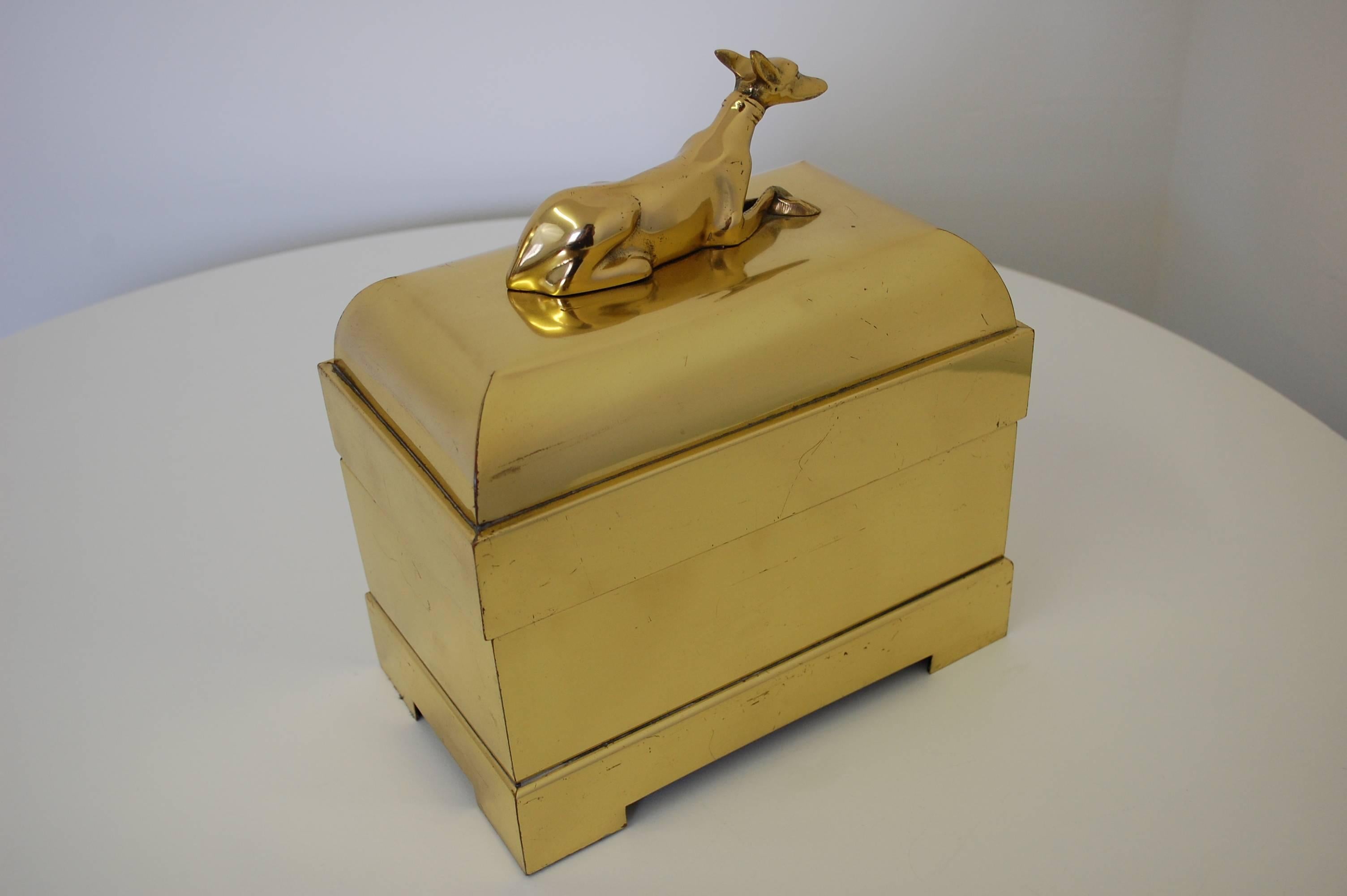 Fabulous vintage lidded brass decorative box with a greyhound figurine handle. Black velvet lined interior. Original company stamp under base.