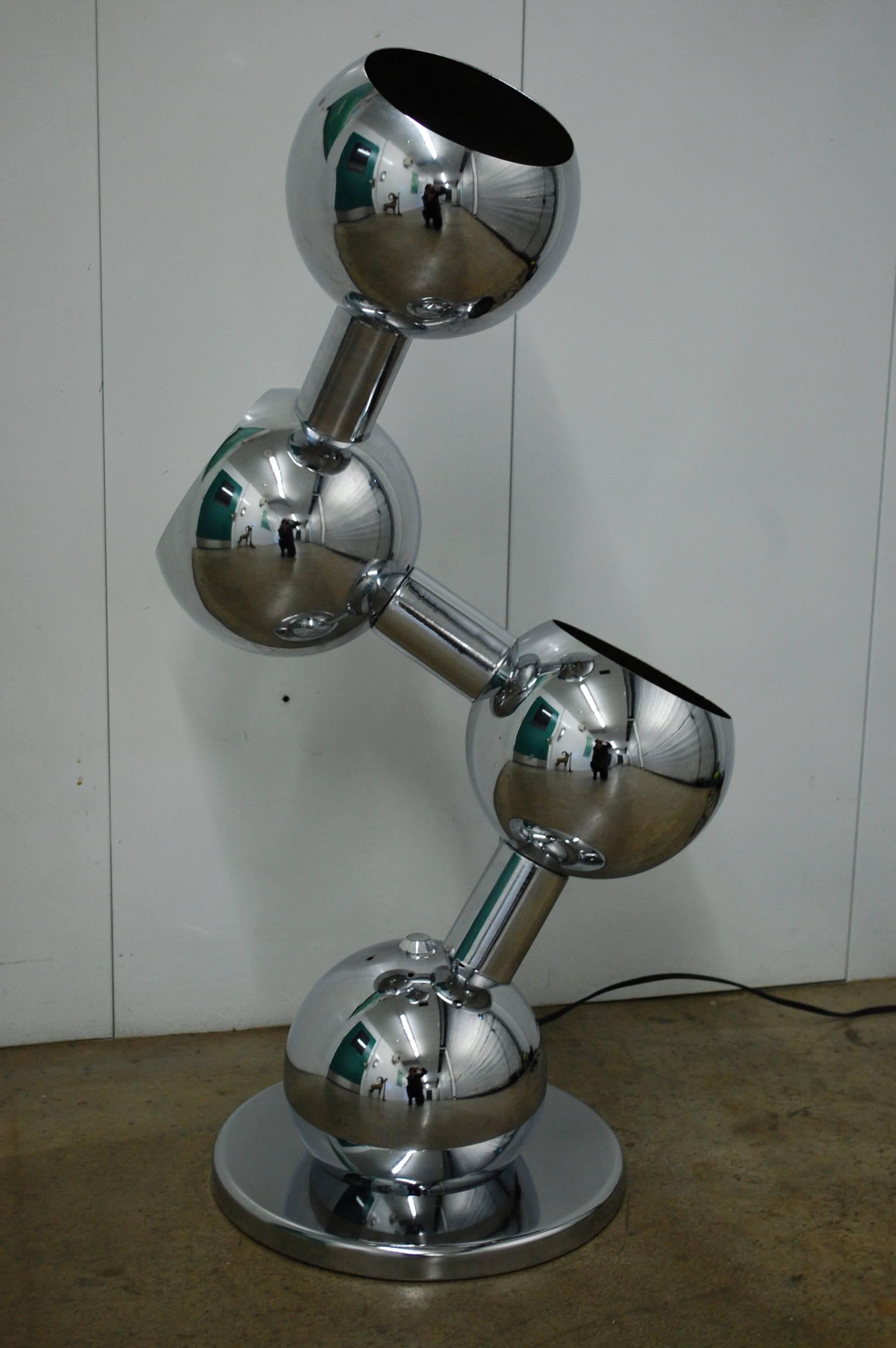 Mid-Century Modern chrome atomic articulating lamp by Robert Sonneman. Switch allows for single light or all three lit option and illuminates well.
