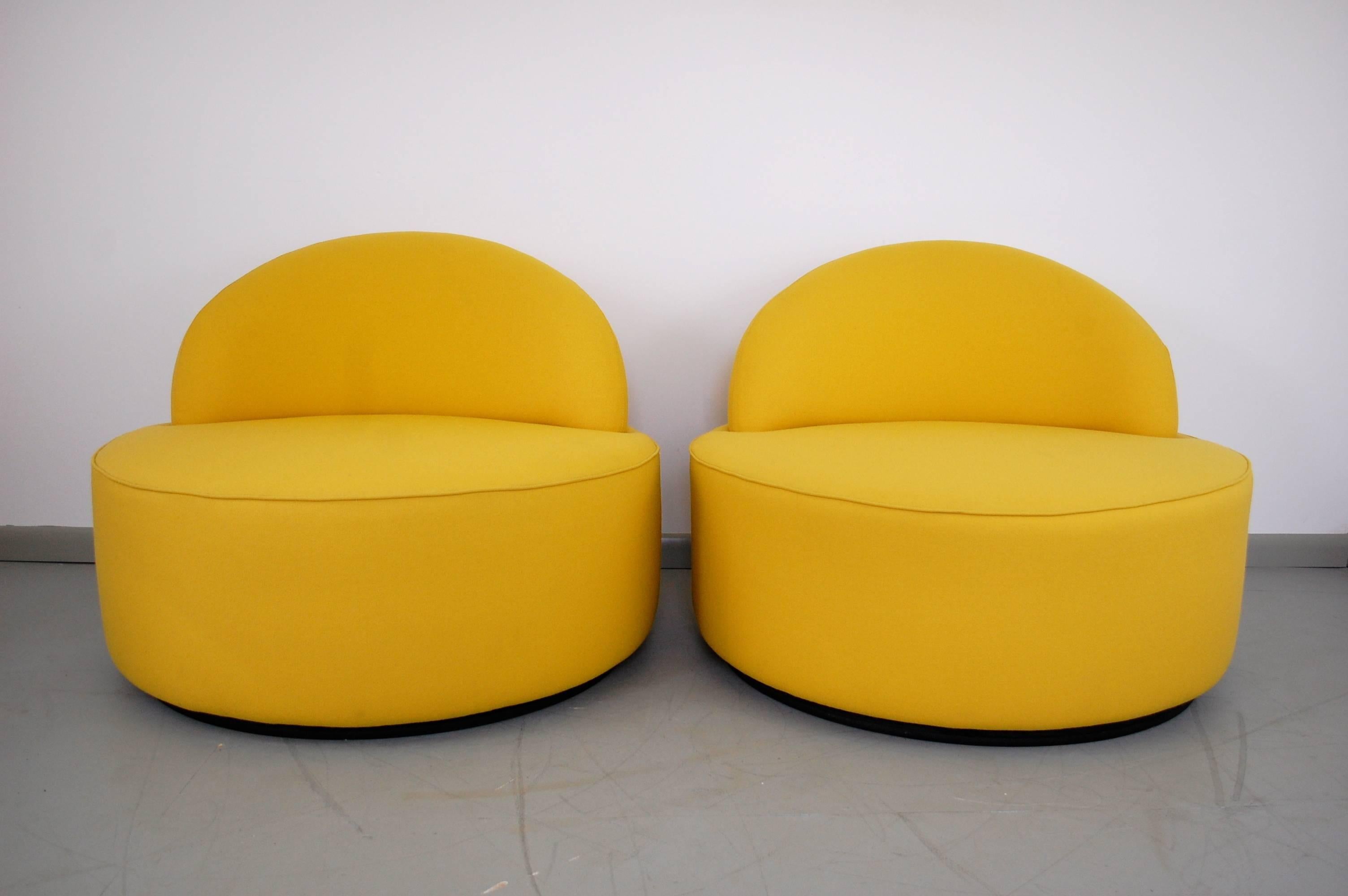 Exceptional pair of Vladimir Kagan "Comete" lounge chairs for Roche Bobois, circa 2003. One of the rarest Kagan designs on the market, the comfort and quality are remarkable. Chairs are upholstered in the original vibrant yellow fabric