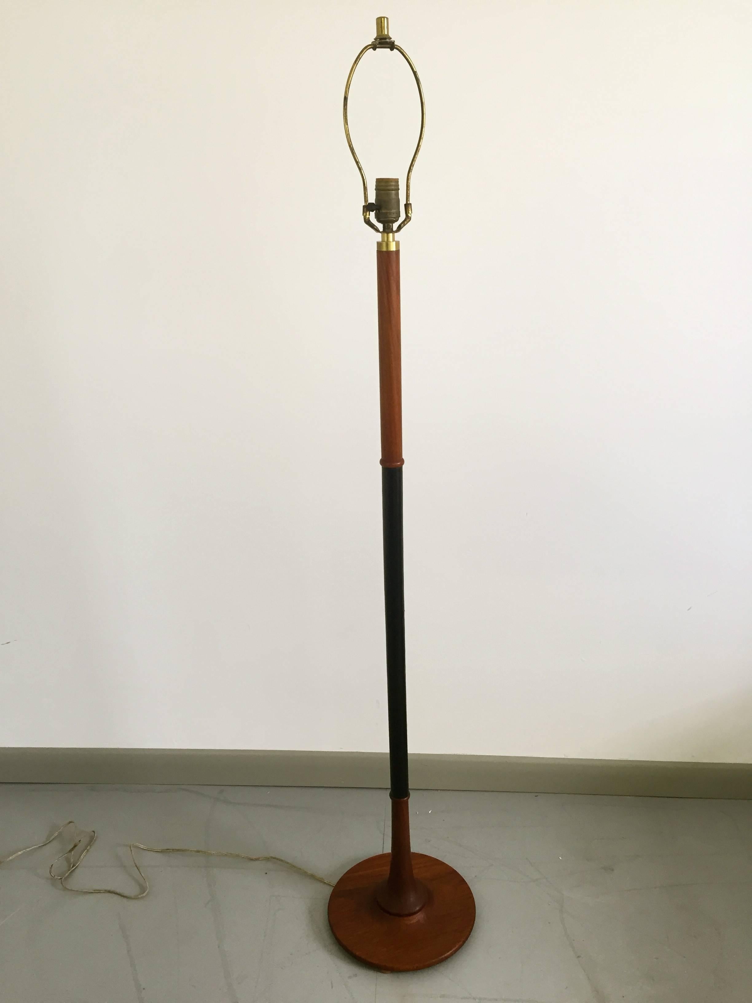 Stunning Mid-Century teak and leather wrapped floor lamp with brass detail. Beautiful construction and attention to detail. Shade is not included. 