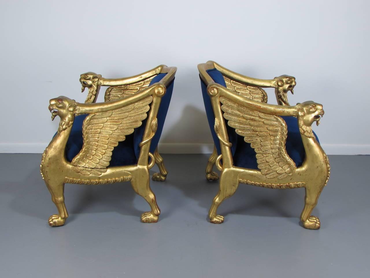 Empire Regal Pair of French Giltwood Winged Bergeres