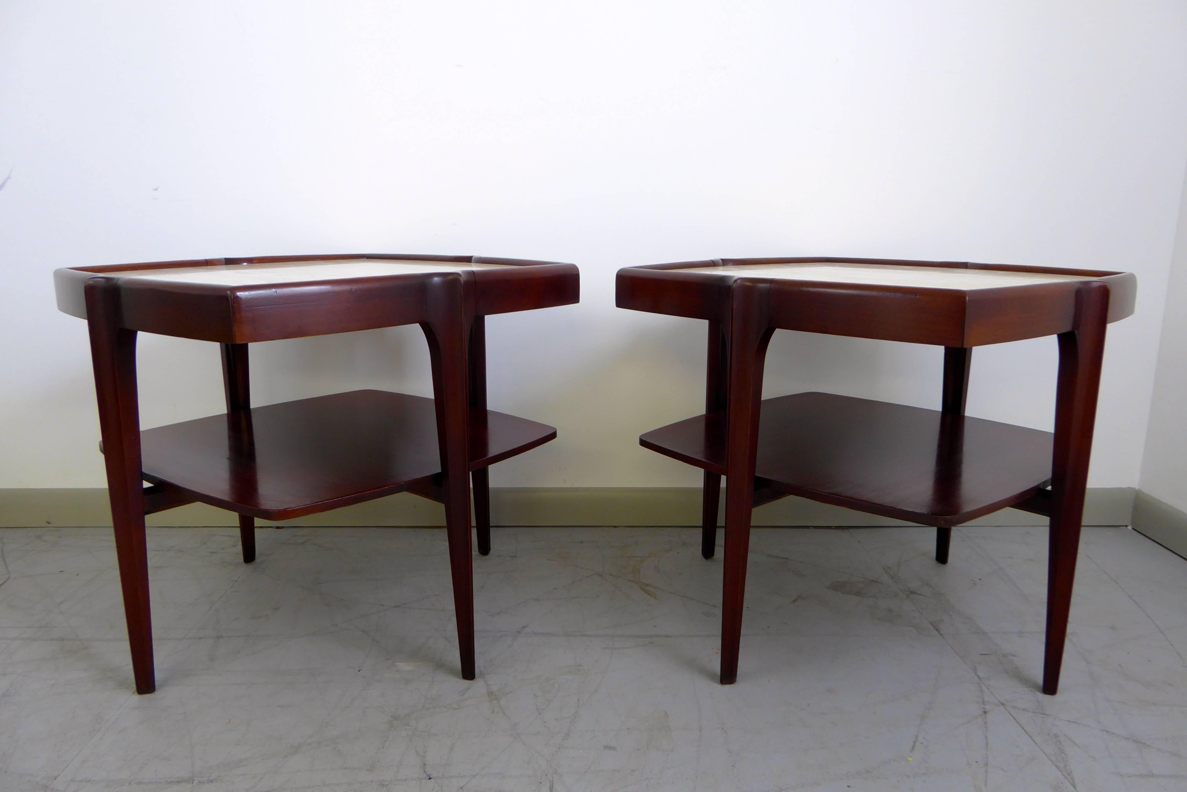 Beautiful pair of mahogany and Italian travertine side tables in the manner of Bertha Schaefer, circa 1960s. Professionally refinished. Stunning detail and design.