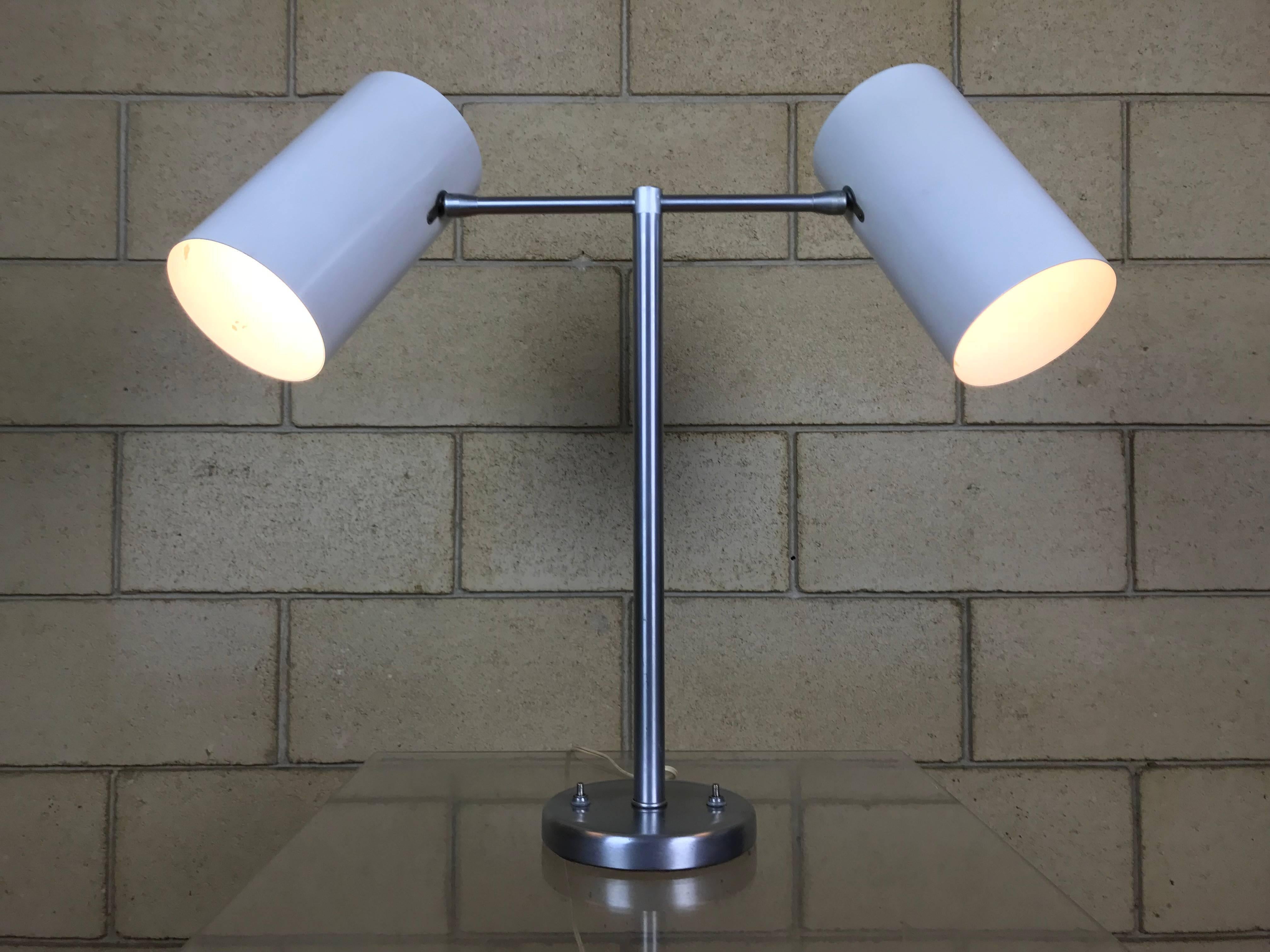 This is a very clean example of modernist design by Walter Von Nessen - the desk lamp has only been cleaned - it is completely original. Each cylinder pivots in all directions to provide light where you want, and has switches on the base that can