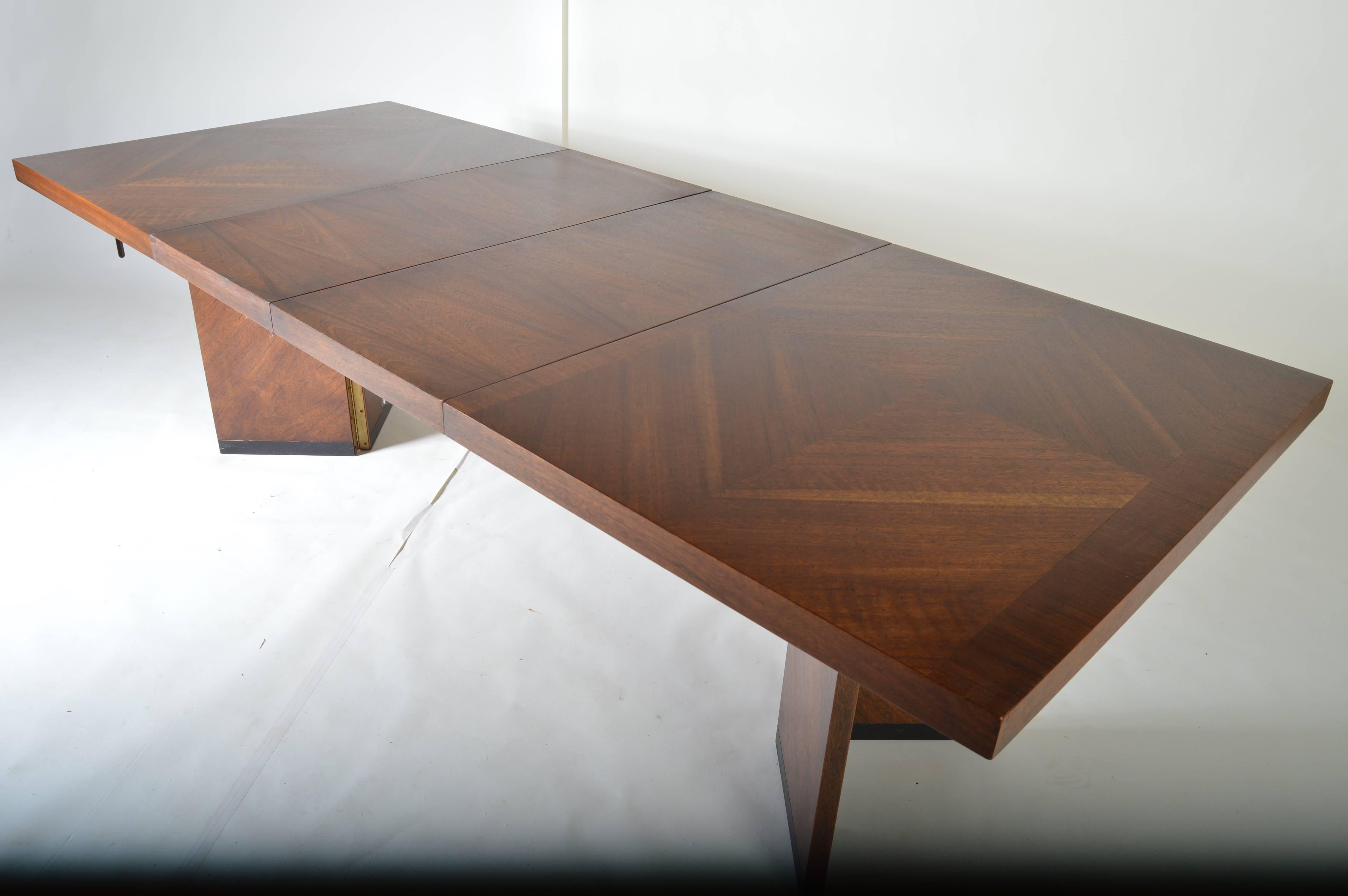 A vintage Lane dining table having crotch grain walnut veneers. Fully extendable and adjustable. 
Measurements while compact: H29