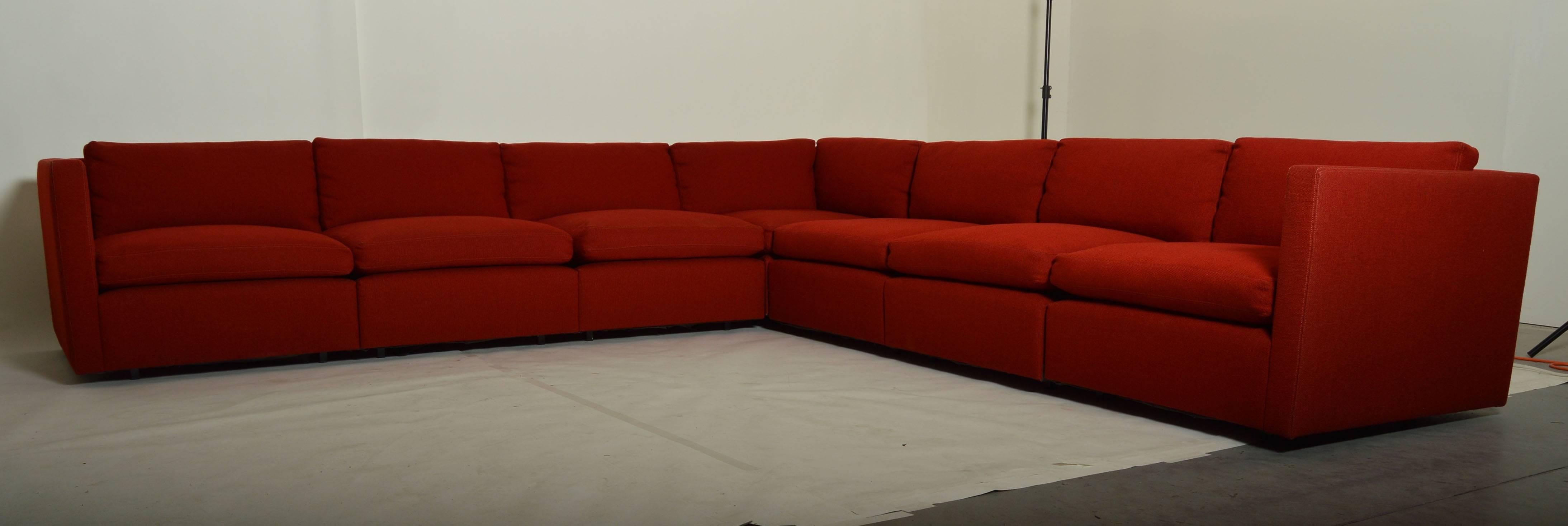 A beautiful modular sectional sofa designed by Charles Pfister for Knoll having lipstick red tweed upholstery. 
Measurements from end to corner each side: 117