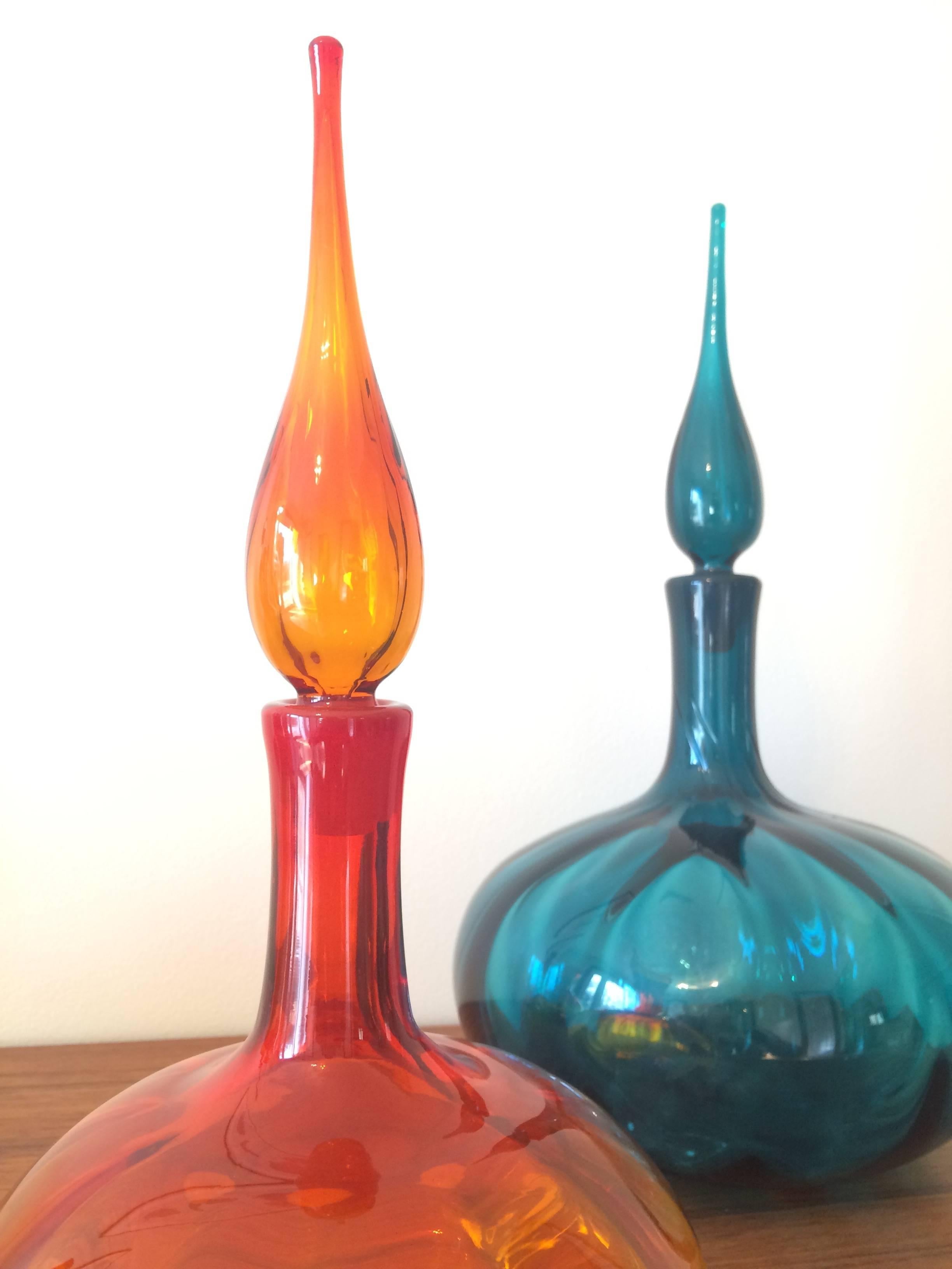 A pair of Mid-Century handblown carafe's with stoppers. 

Orange vase measures: 13.75 H x 7
