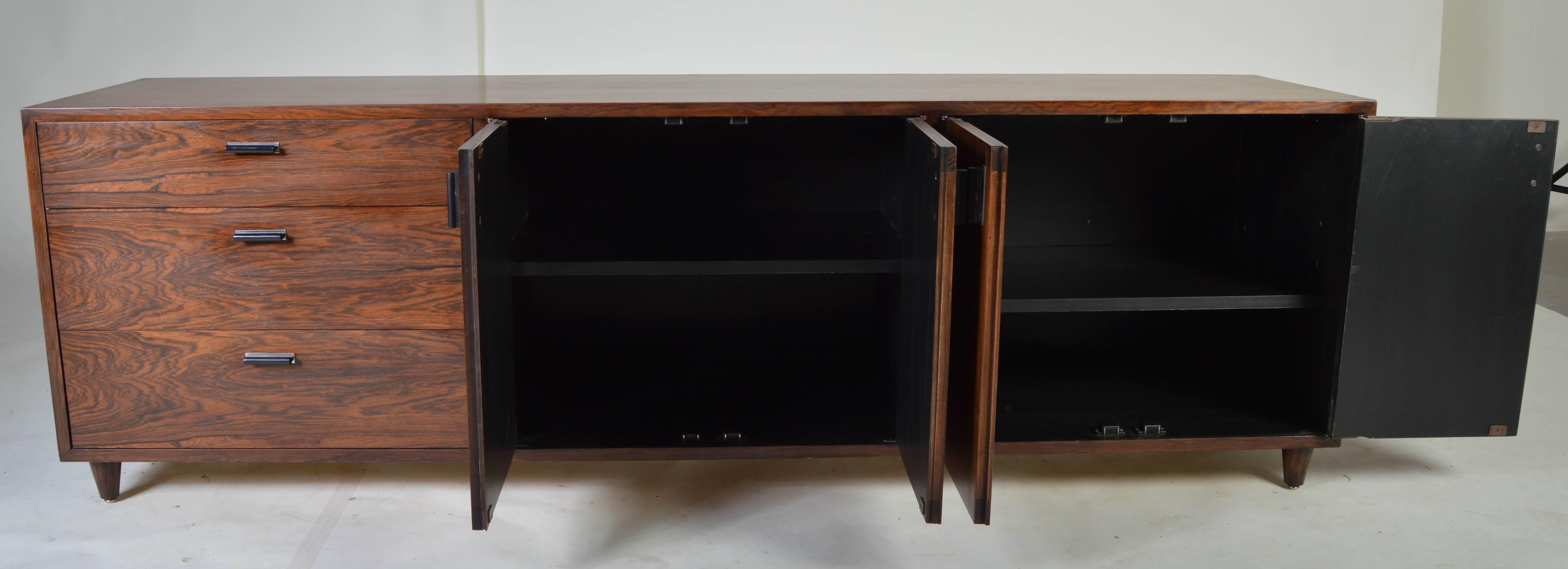 An incredibly rare, early 1950s rosewood credenza by Founders after George Nelson. A truly beautiful piece.
