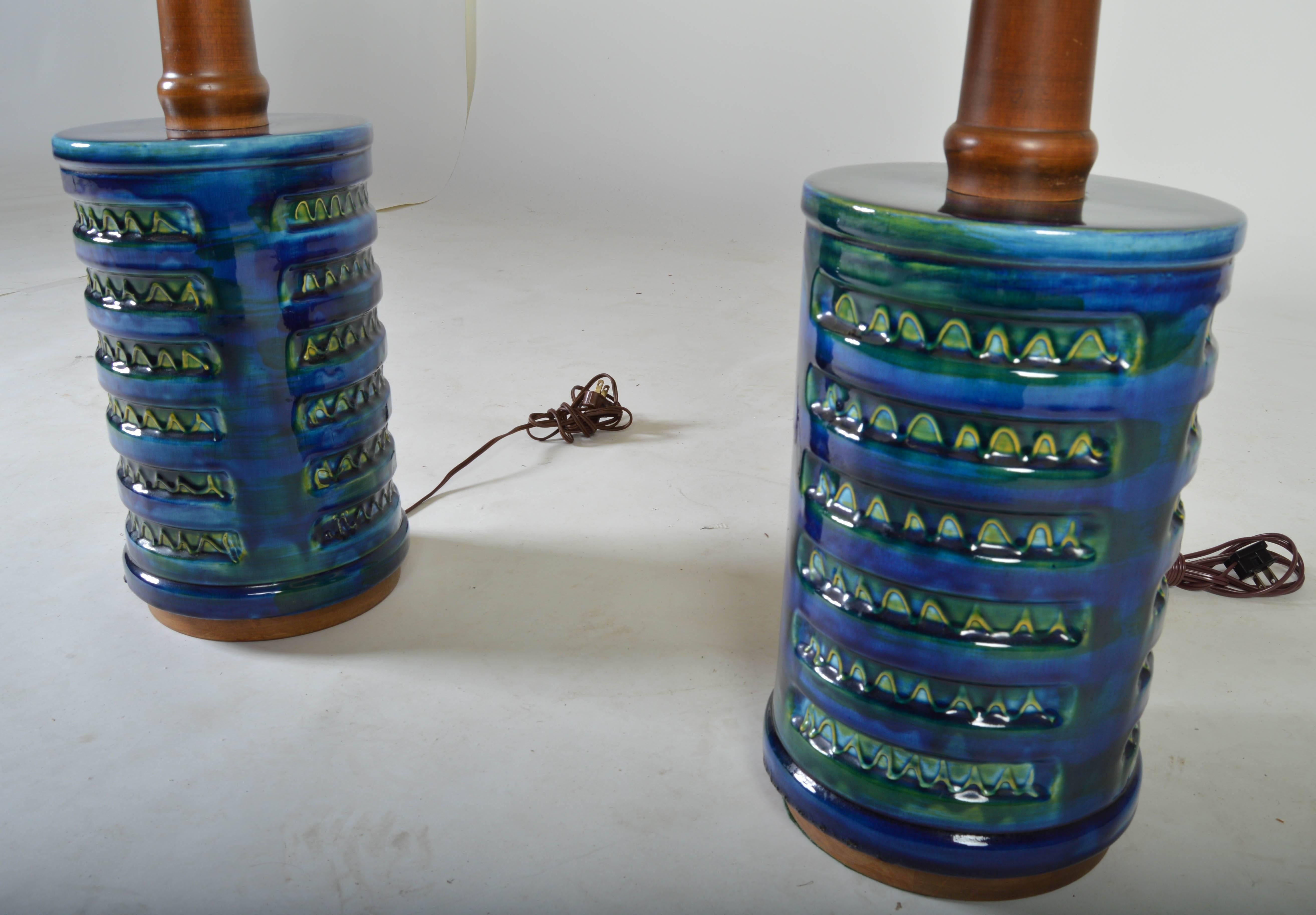 An amazing pair of blue and green porcelain drip glazed cylinder table lamps having walnut stems.
Two of the finest porcelain table lamps I've ever seen. 

Shade height: 17