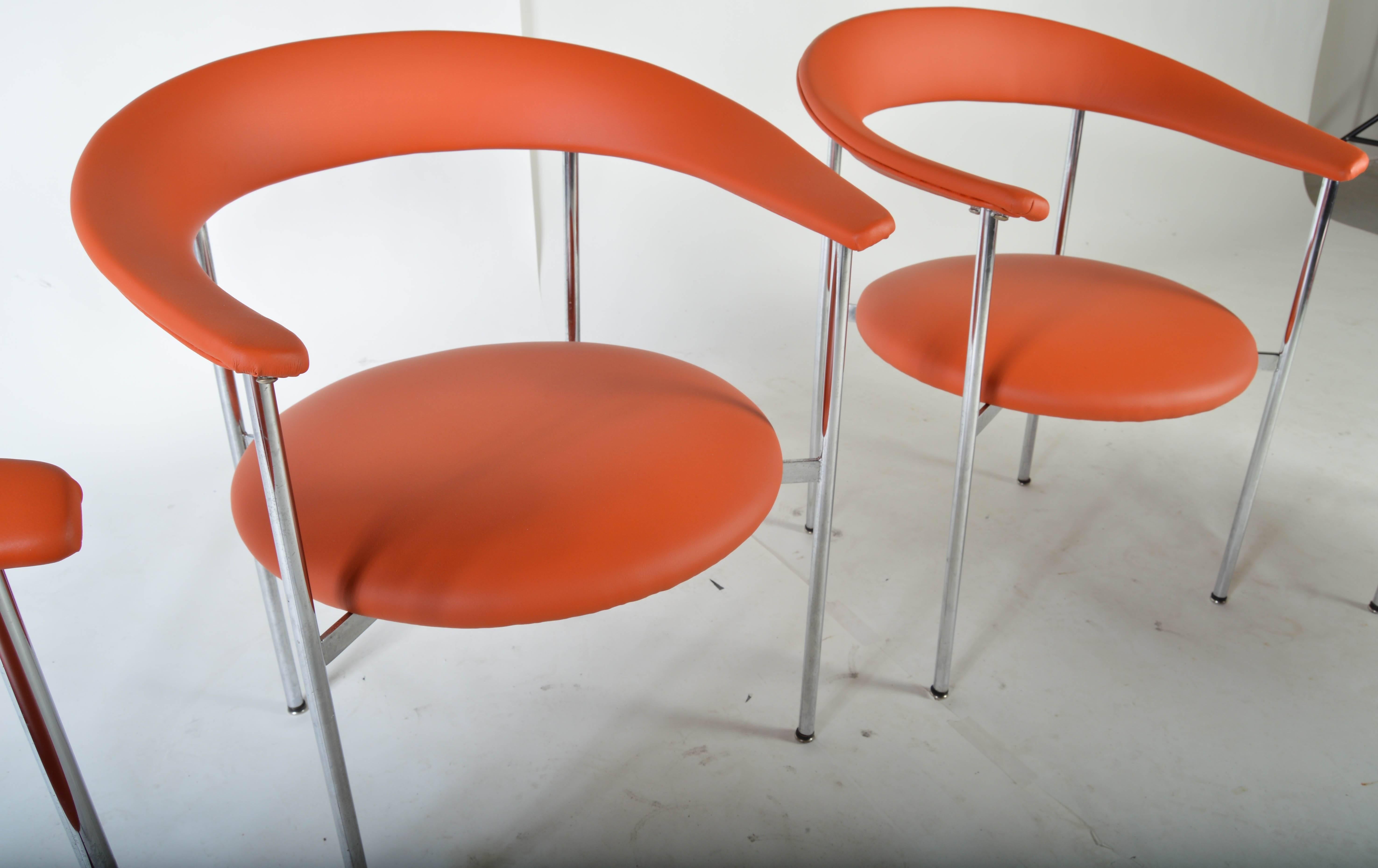 A set of four dining chairs designed by John Yellen for the I.V. Chair Corporation. Two larger end chairs and two side chairs. There is a 5th and 6th  chair available. They are side chairs and match exactly. 
 Original manufacturer is I.V. Chair