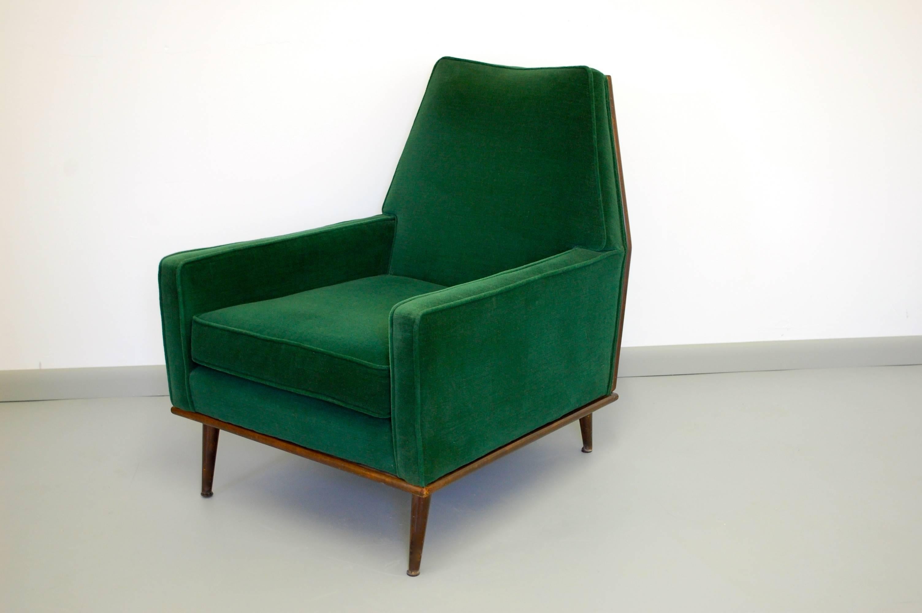 Incredible Mid-Century Modern lounge chair with stunning original emerald green mohair surrounded by walnut frame. Incredibly comfortable, dynamic chair.