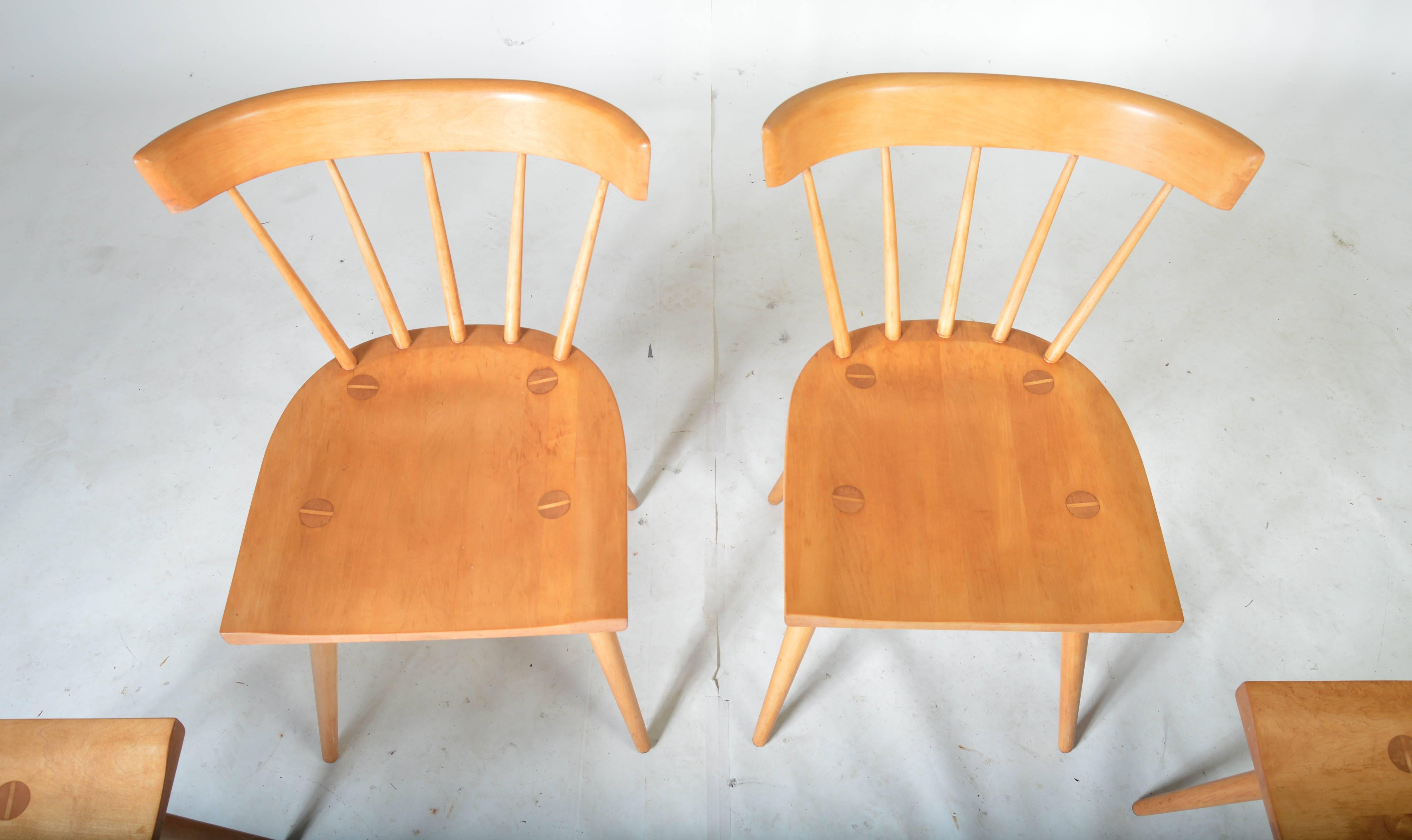 A beautiful set of Planner Group dining chairs designed by Paul McCobb having solid maple construction.