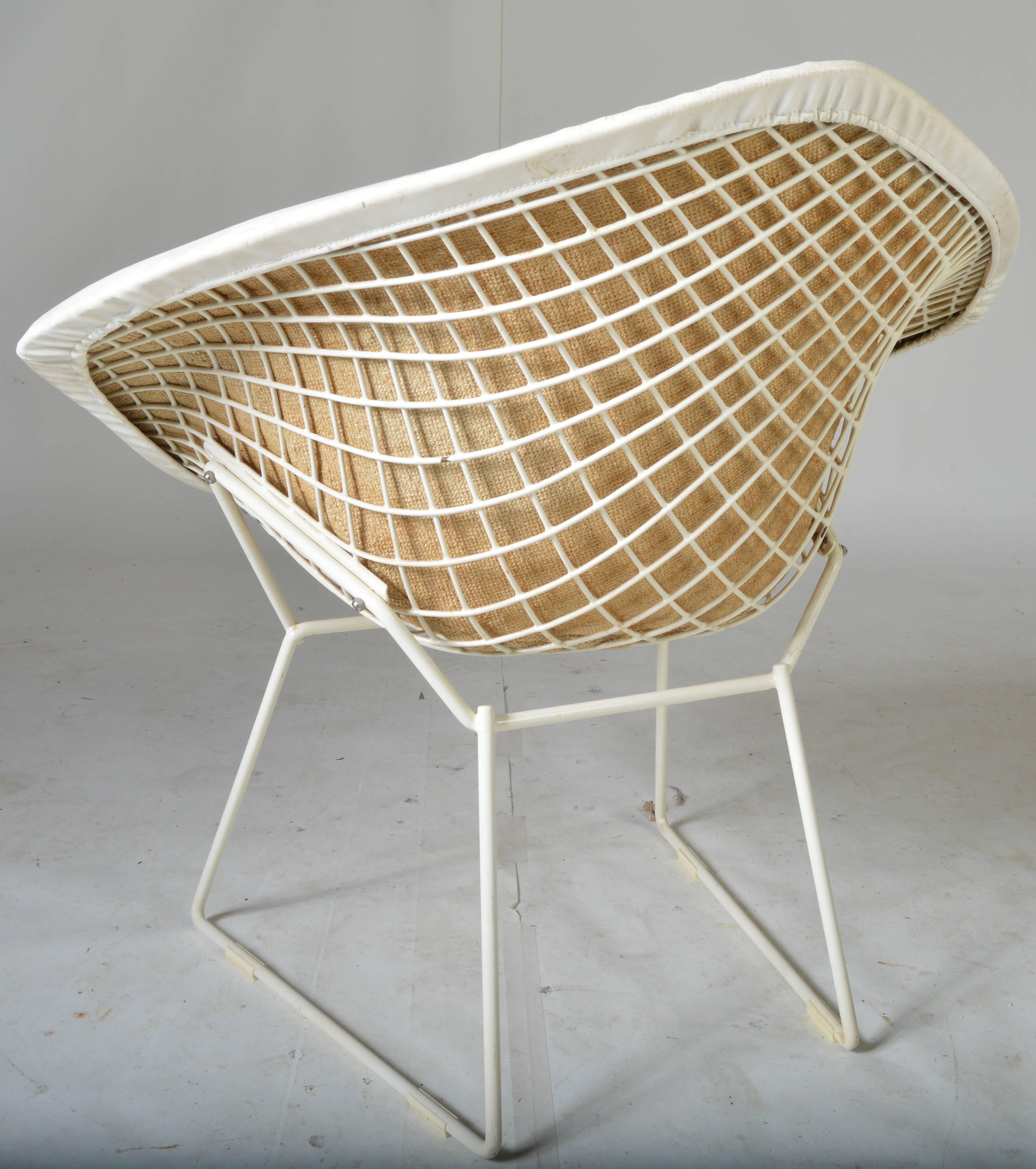 A stunning example of Harry Bertoia's Classic diamond chair in white having it's original white leather cover. Breathtaking!