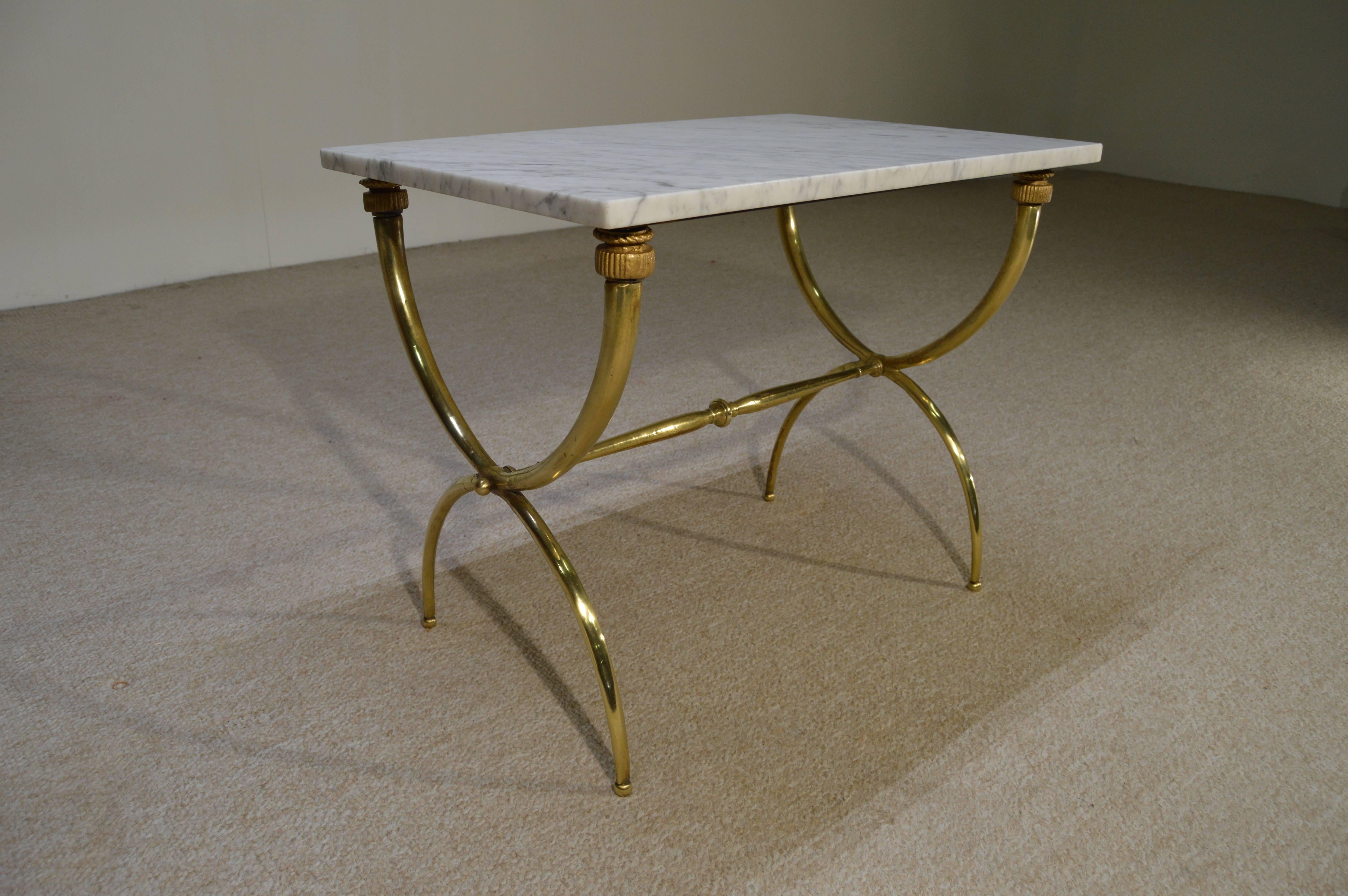 A stunning Gio Ponti style Italian console table having a marble-top and polished brass base, circa 1950.