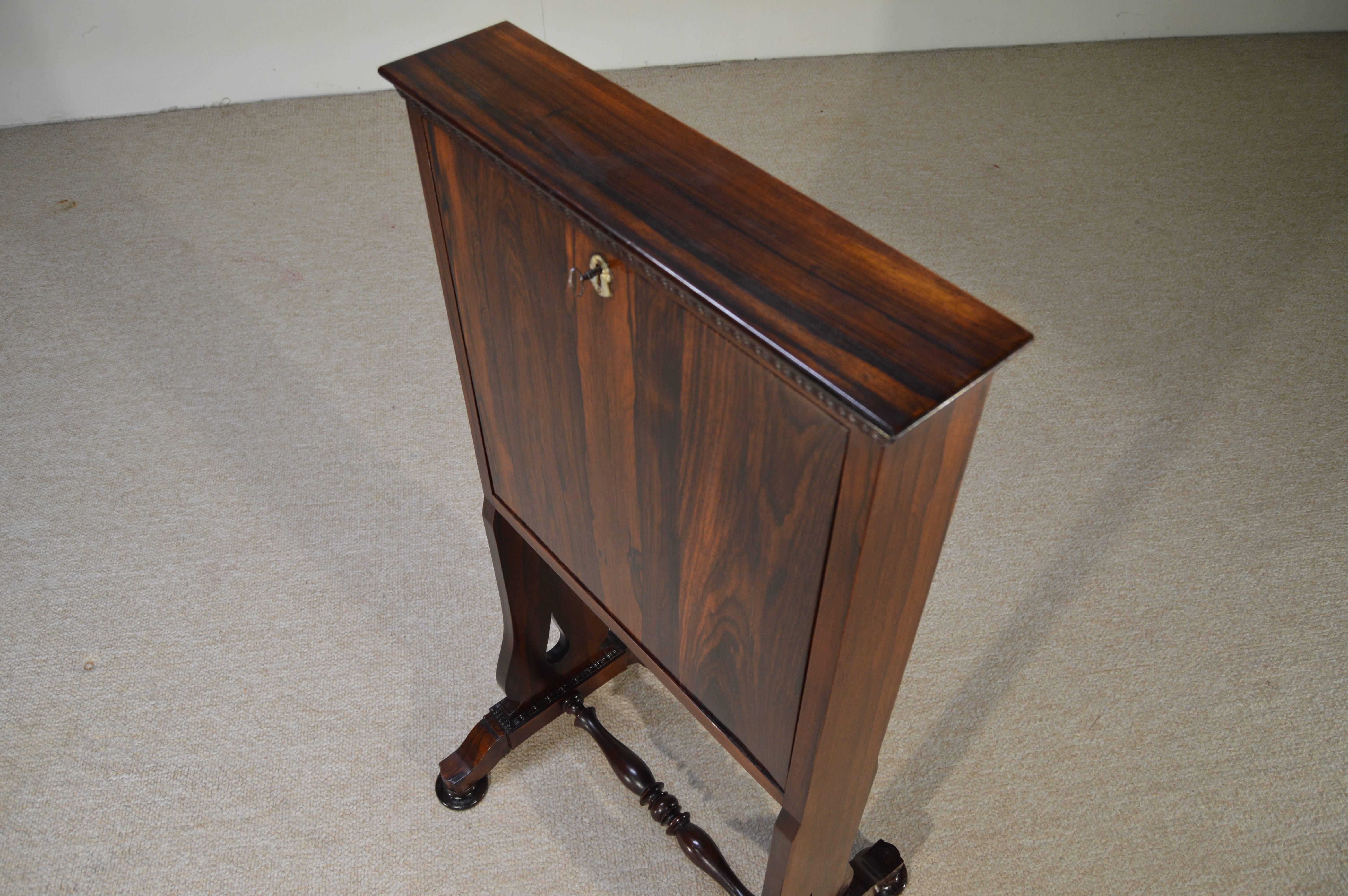 A stunning 1800s desk having Brazilian rosewood exterior and leather desk surface. A gorgeous and extremely rare secretary.
The black leather is in wonderful antique condition, wonderfully worn, with gold tooling lining the perimeter. 

Measures: