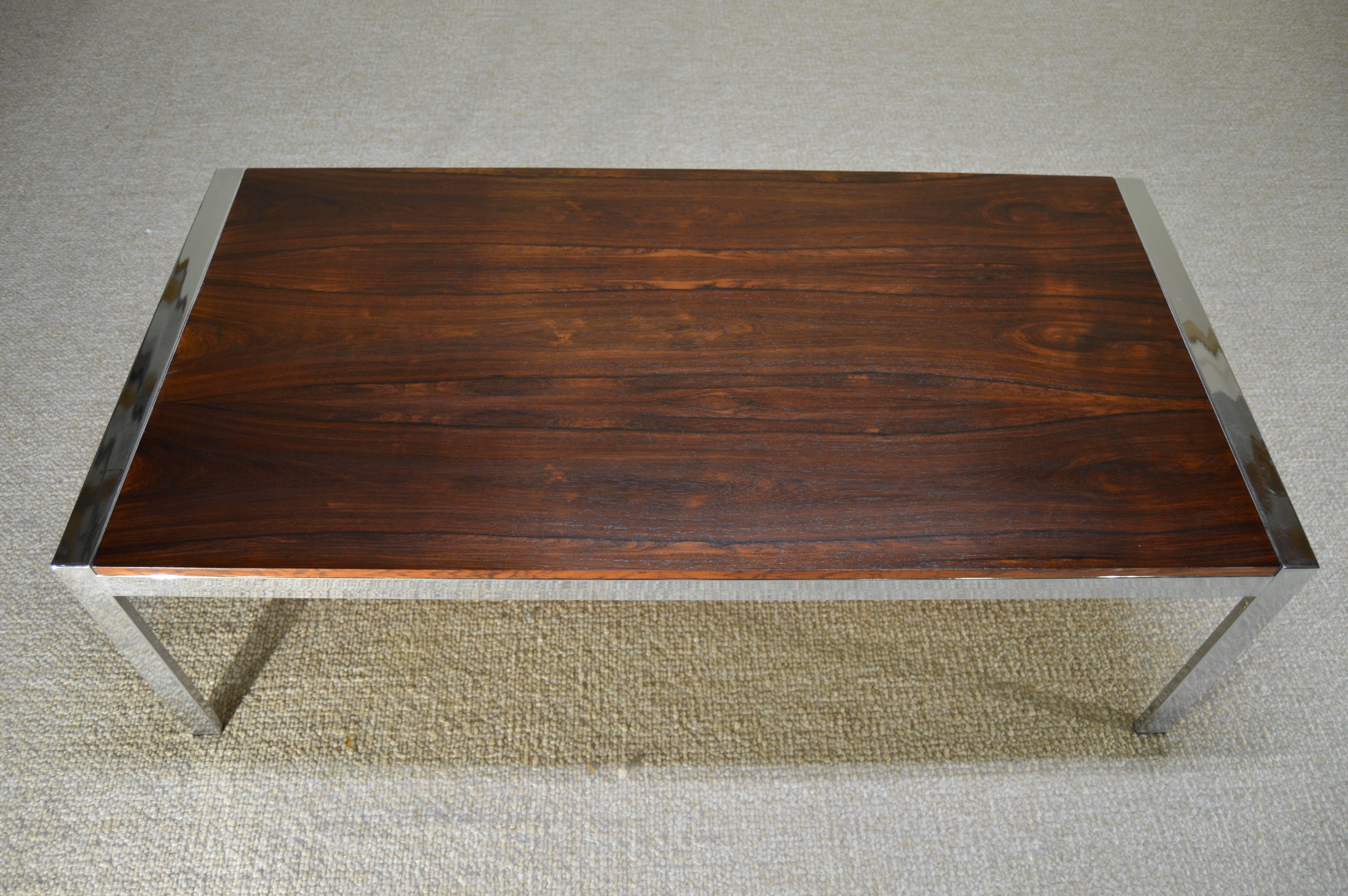 Howard Miller rosewood and chrome coffee table produced by MDA in Sussex, England in the 1960s. Beautiful vintage condition.