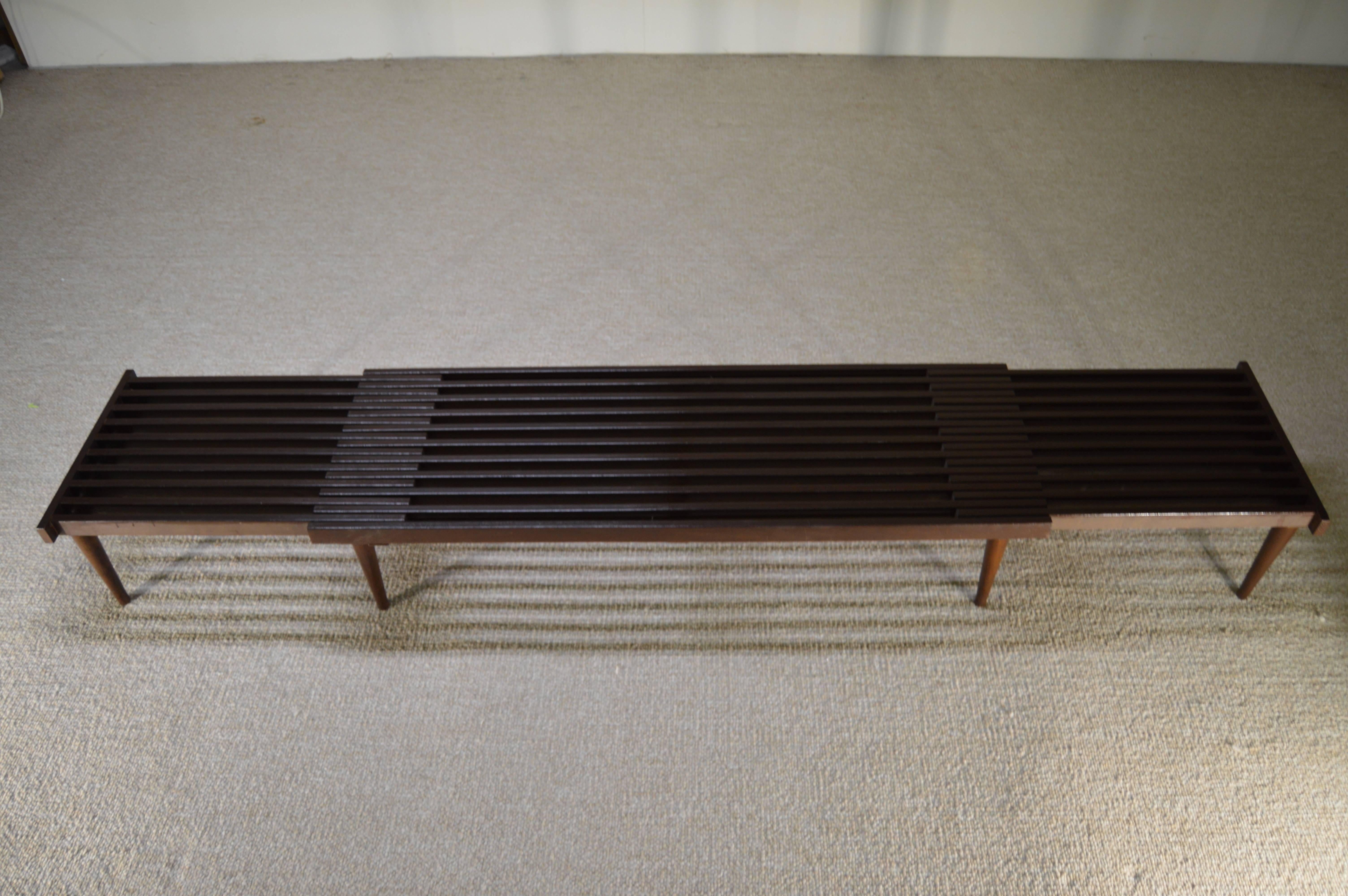 A stunning expandable sliding slat bench designed by John Keal for Brown Saltman.
Measures: Can expand from 61