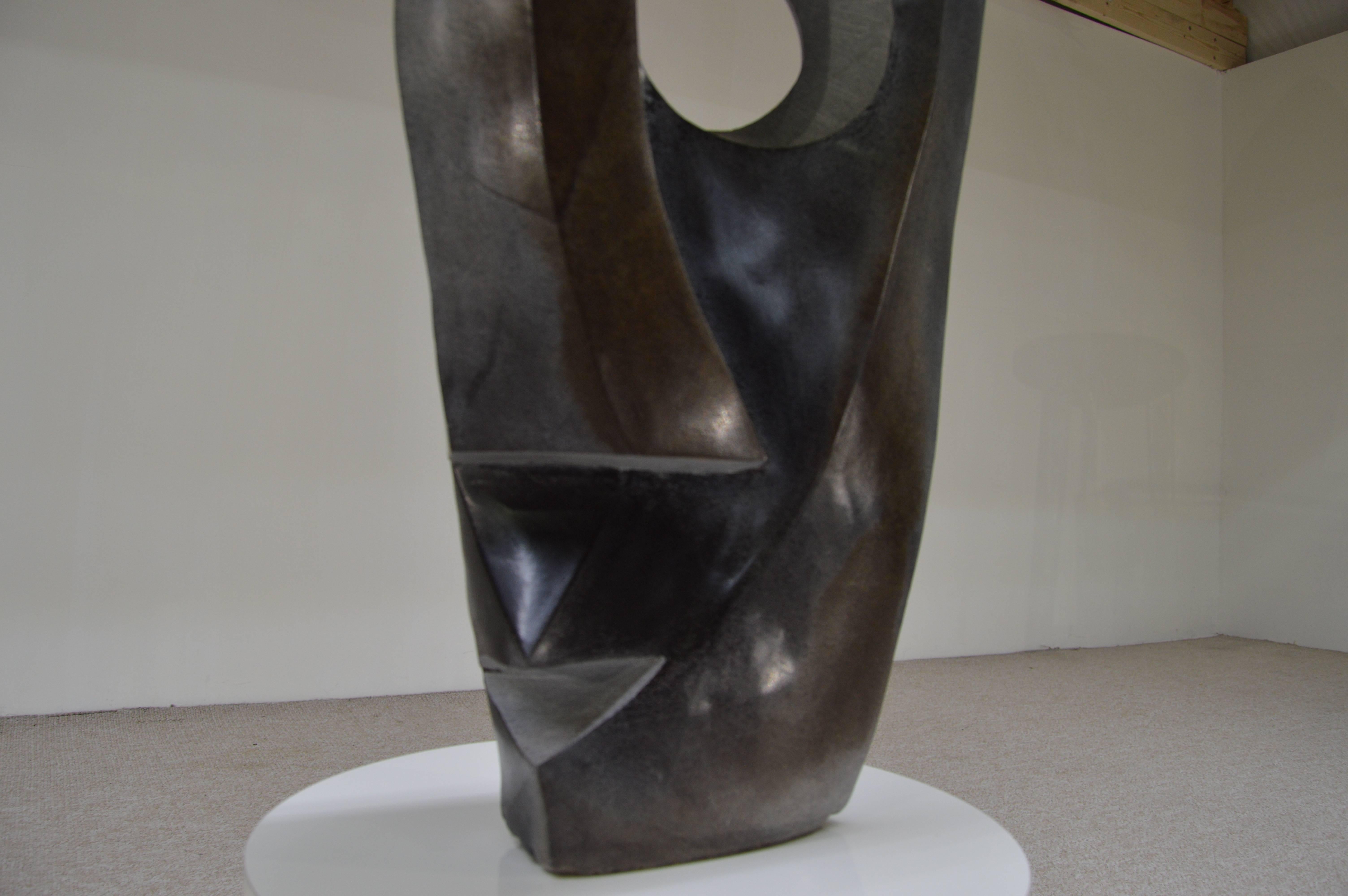 A stunning Pablo Picasso style stone sculpture titled "Look More, Talk Less" by W. Nyika or Sango shaped into a single piece of spring stone. Absolutely gorgeous.