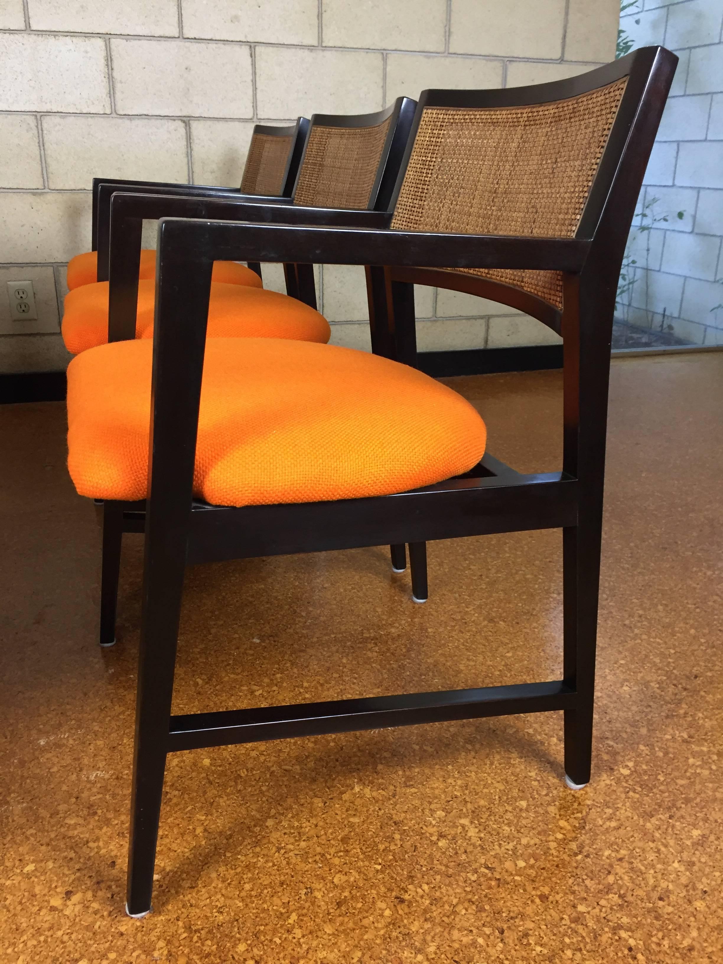 Absolutely gorgeous set of six Edward Wormley for Dunbar dining armchairs. Original condition with minimal. Reupholstered in vintage Herman Miller orange tweed fabric. 

Measures: 22" wide x 20" deep x 31" tall. 18" seat height.