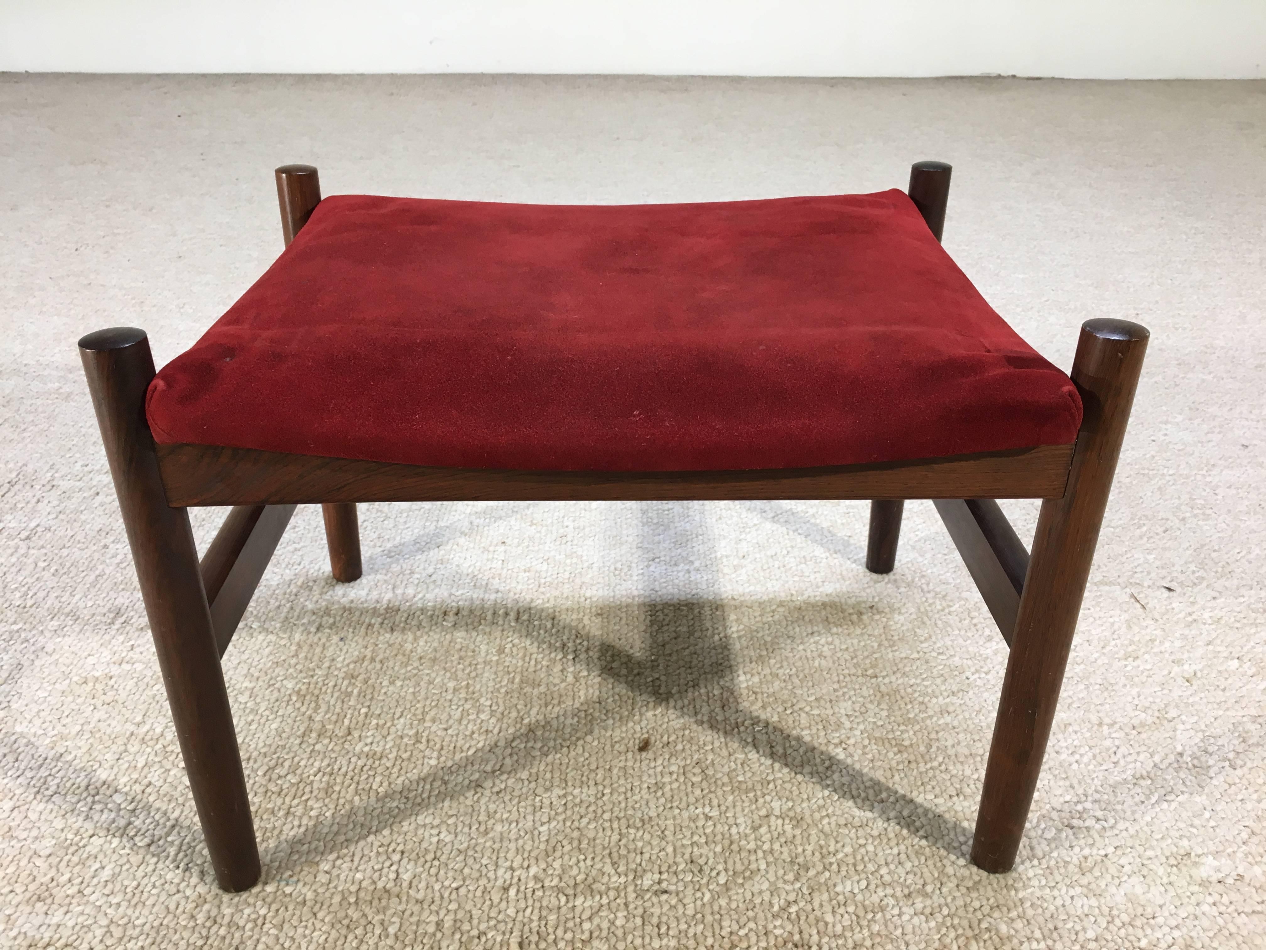 A beautiful design by Spottrup having rosewood frame and suede upholstery.
We have a second matching rosewood Spottrup ottoman listed for sale as well in black suede.