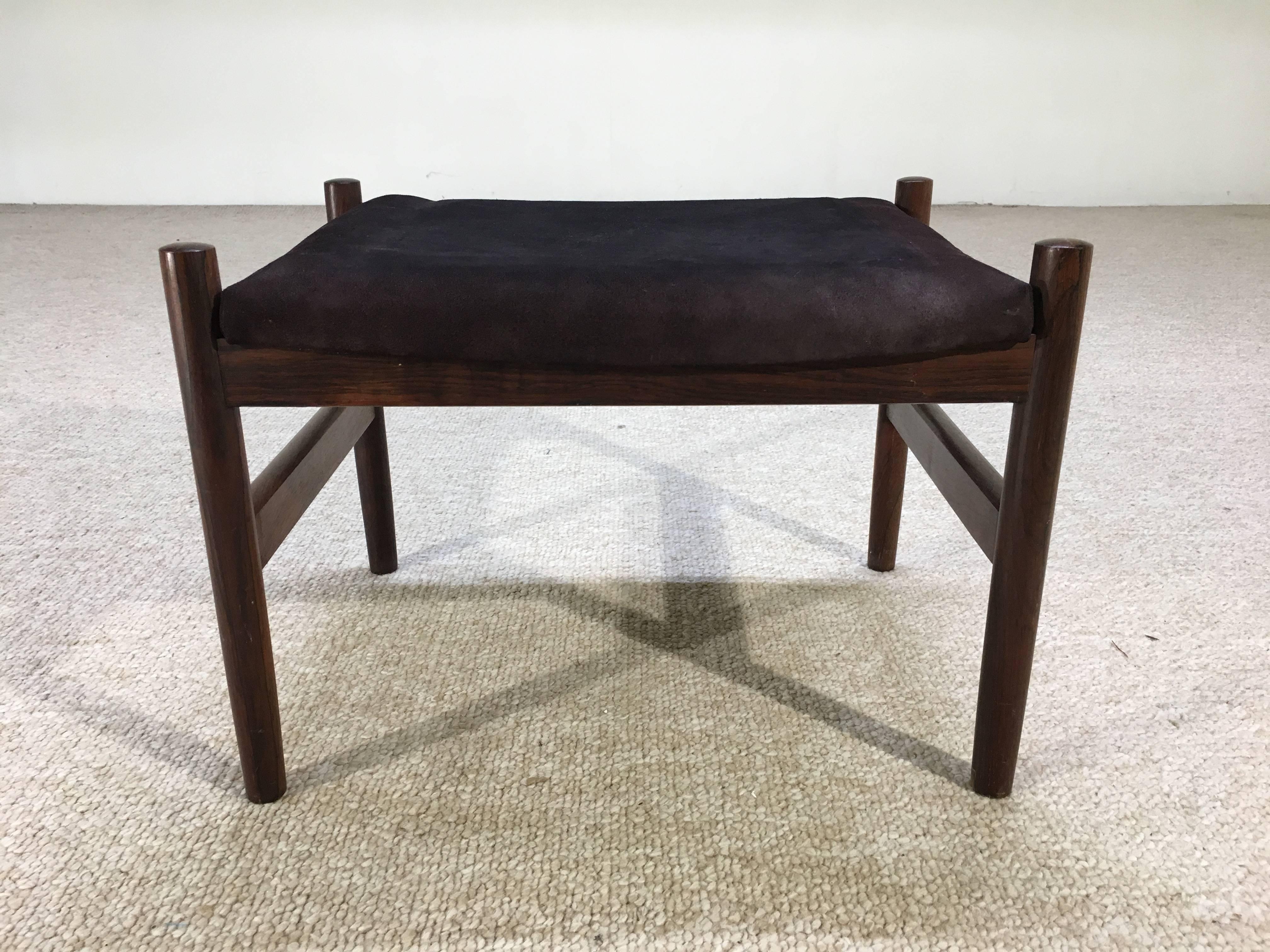 A beautiful design framed in rosewood with suede upholstery.
We have a matching rosewood Spottrup ottoman listed as well in red suede if you need a pair.
