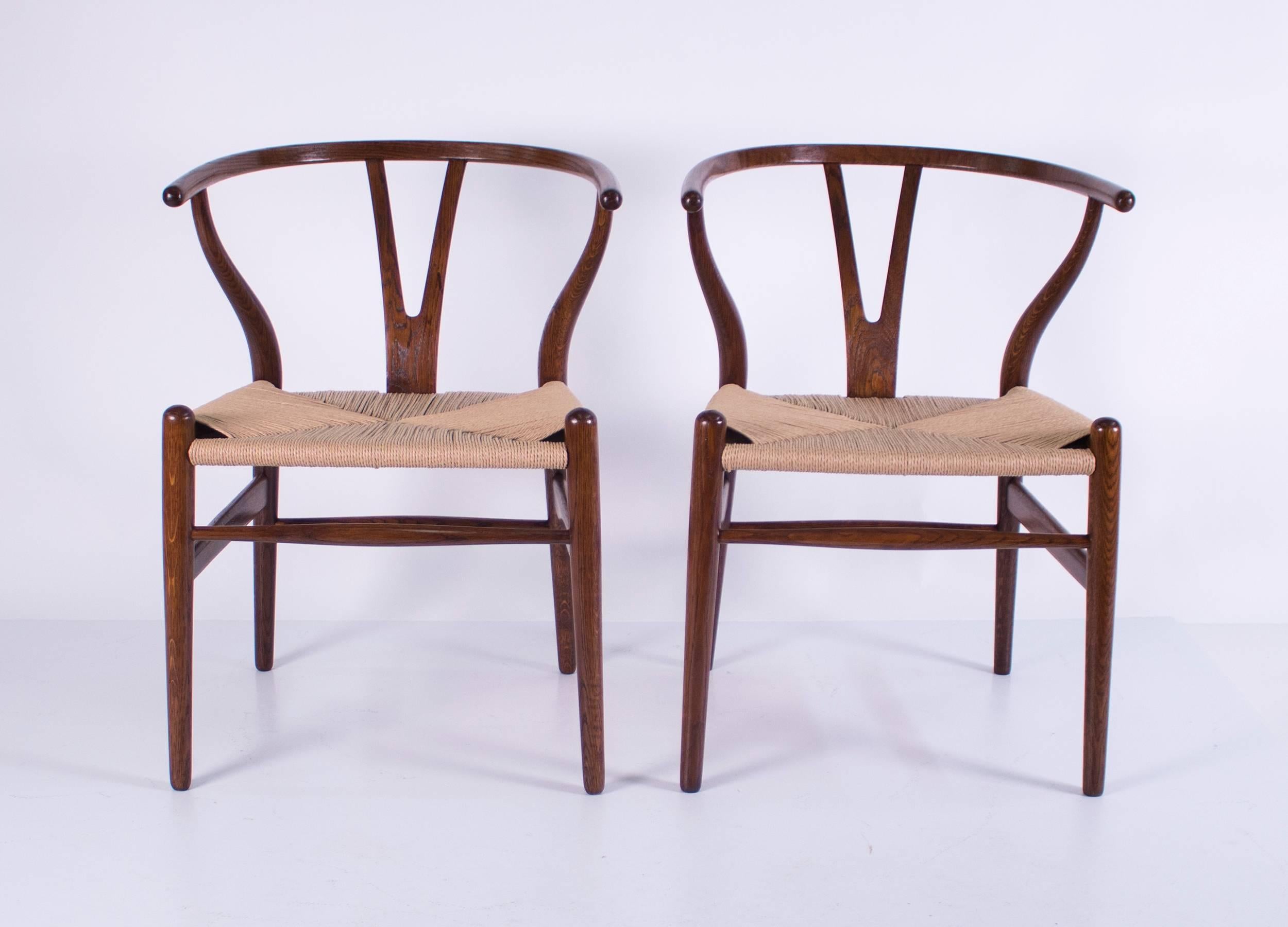 A gorgeous set of four Hans Wegner wishbone chairs having oak frames and freshly corded seats. Beautifully refinished, circa 1960.