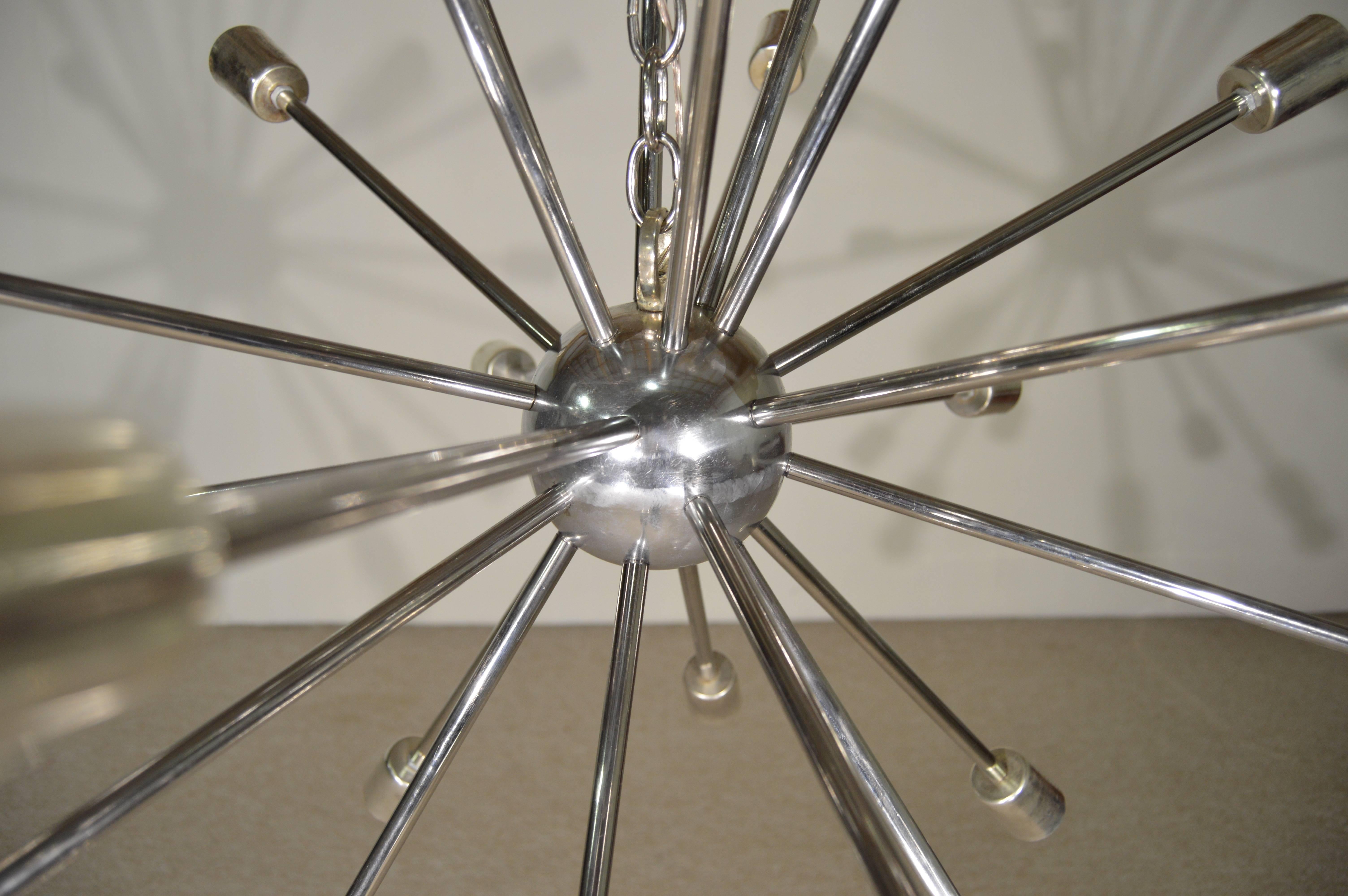 Spanning 32" in diameter, this beautiful early example of the Classic Sputnik chandelier design is a true statement piece. Dawning 23 bulb arms this light is magnificent when lit. (Please excuse us for not having enough bulbs to mount for