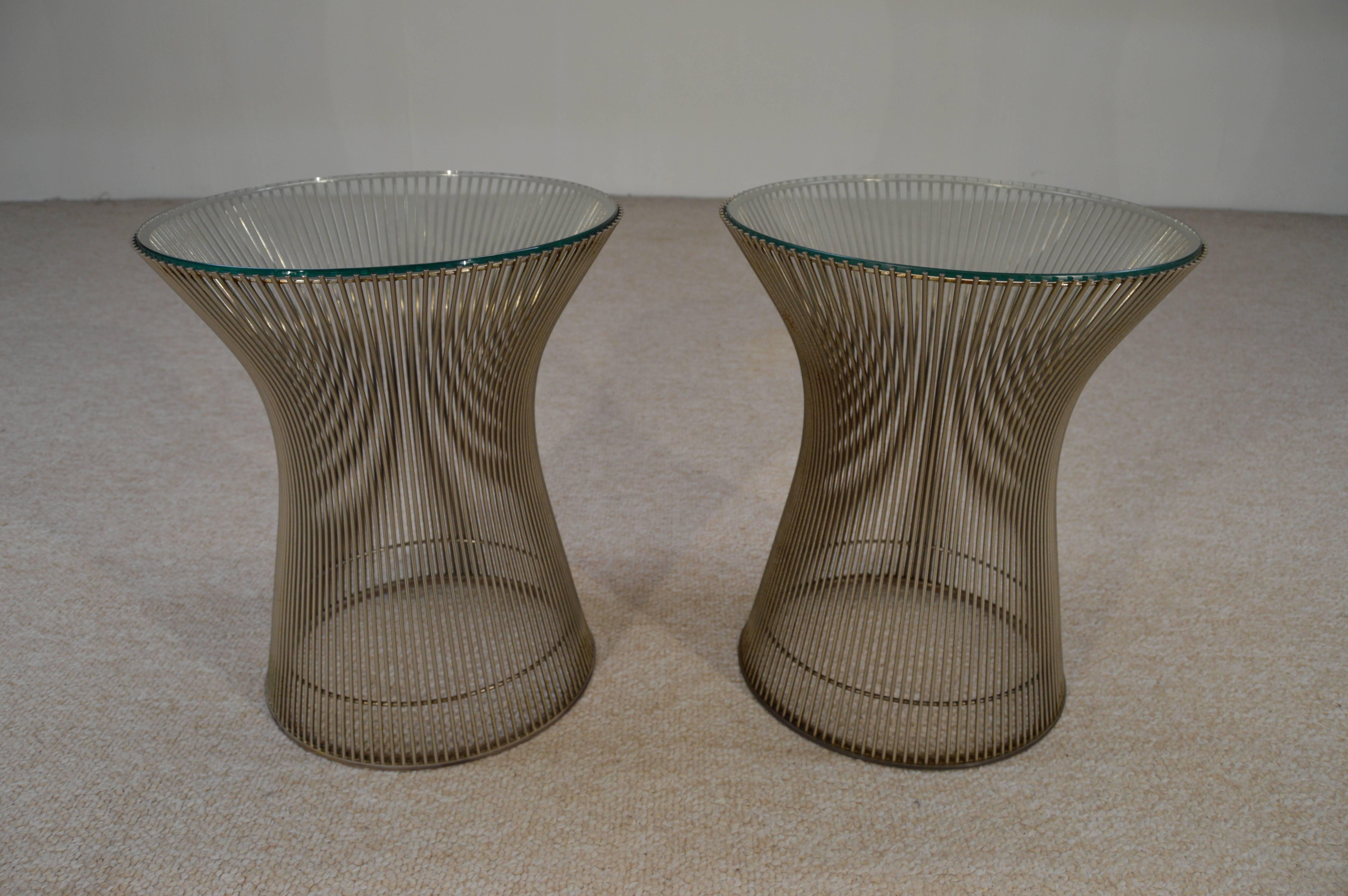 Early production pair of rare nickel glass top side tables designed by Warren Platner for Knoll. A Classic, beautiful design.
Original floor guards present. 

Measures: These are the larger 15 3/4" examples.