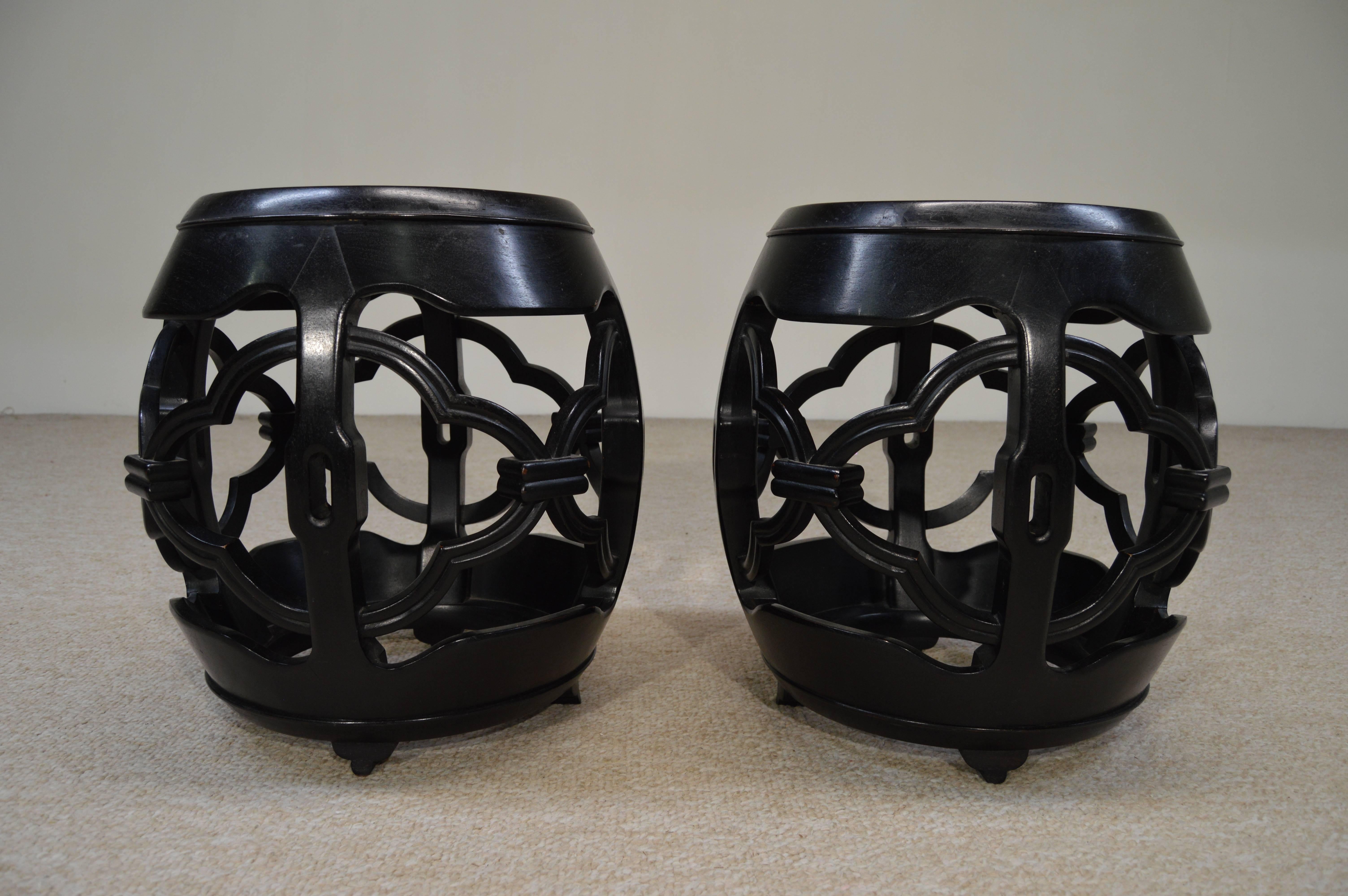 Beautifully hand-carved ebony barrel drum bases with inlaid Carrara marble tops. This eye catching pair will stun anyone who enters the room. Every time I'm in the warehouse I can not help but glance over at these. They are so beautiful. 
Marble