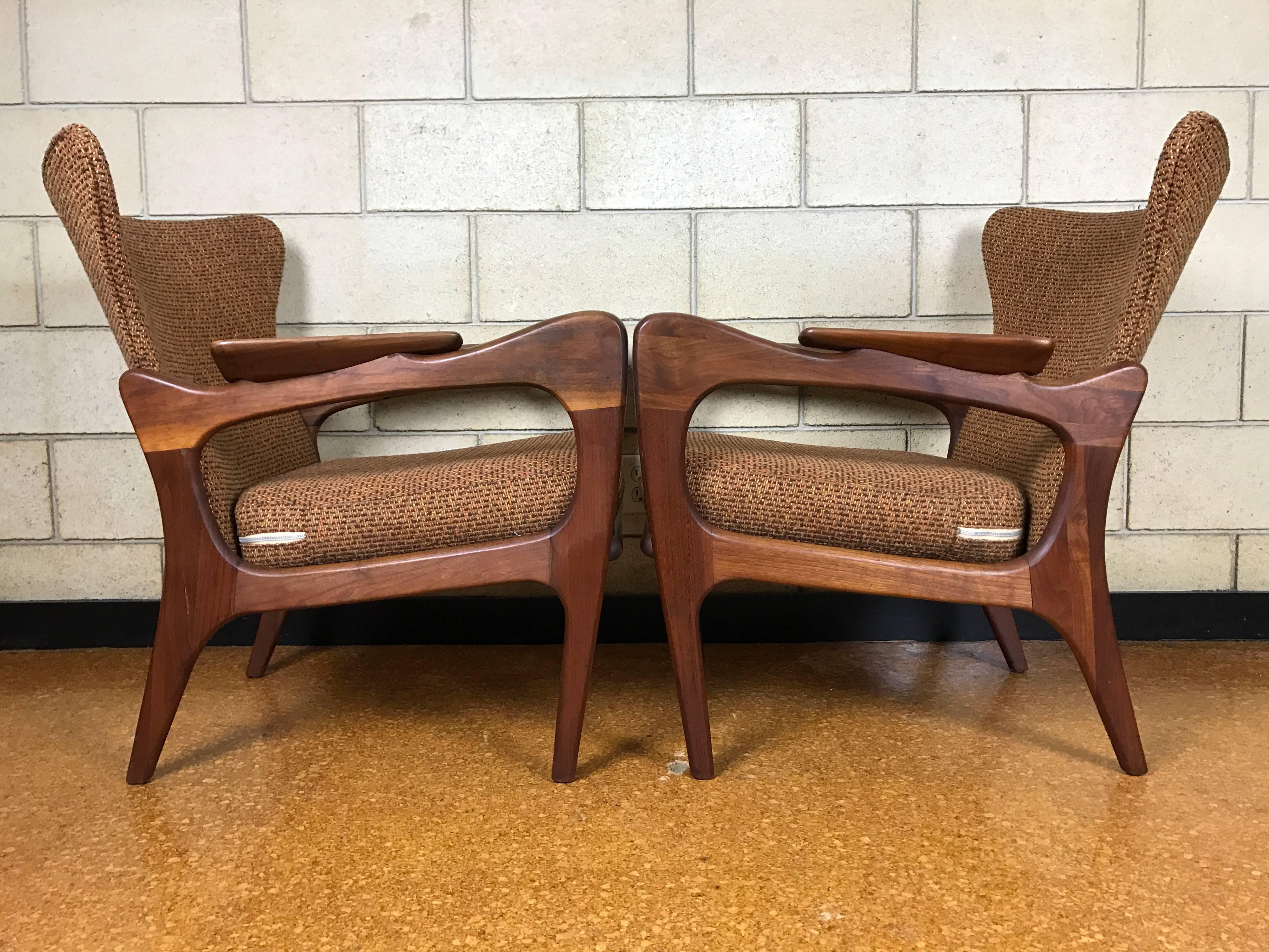 A stunning pair of sculptural solid walnut wingback lounge chairs by Adrian Pearsall for Craft Associates. 

Original condition - fabric is clean. Foam is a little hard on the back.