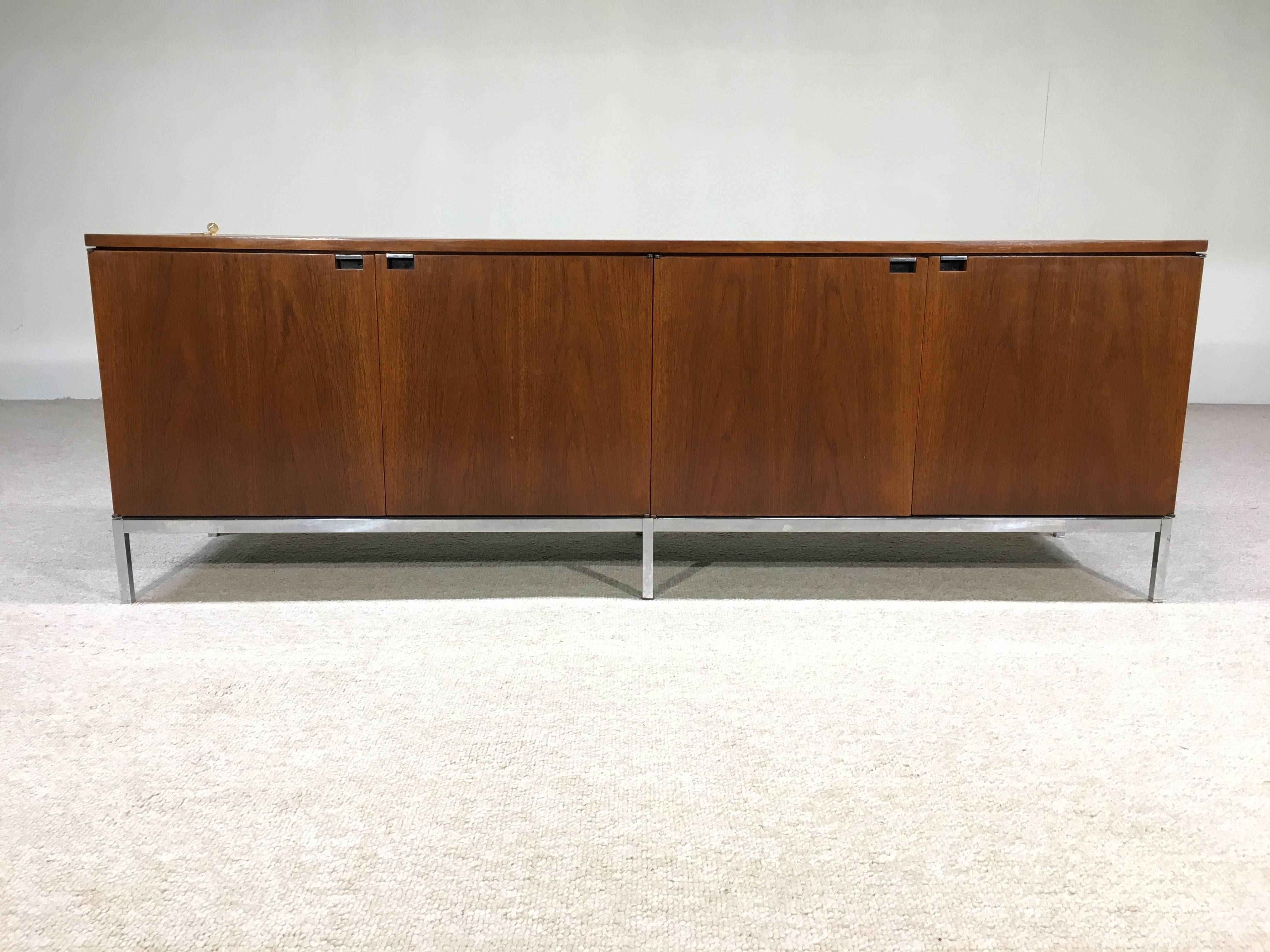 Early Florence Knoll walnut credenza with flush mount pulls. Keys for lock included! Very nice vintage condition.