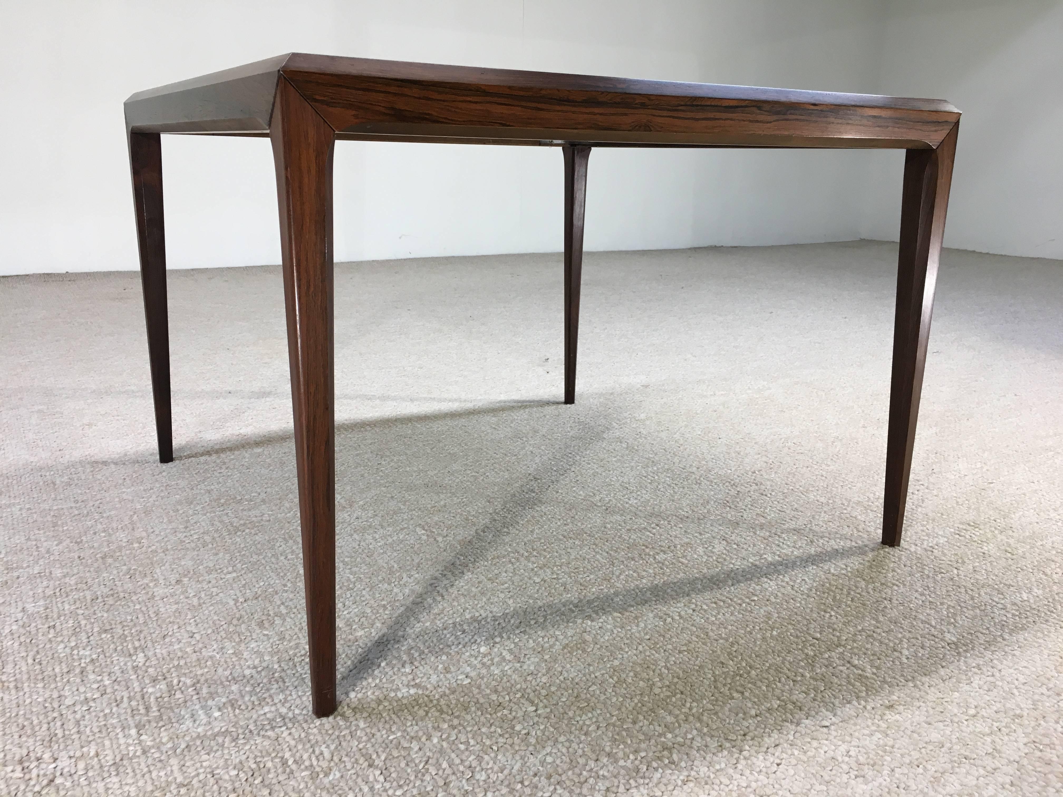Stunning grain on this sleek example of Scandinavian Modern design by Silkeborg. This table grabs the eye.