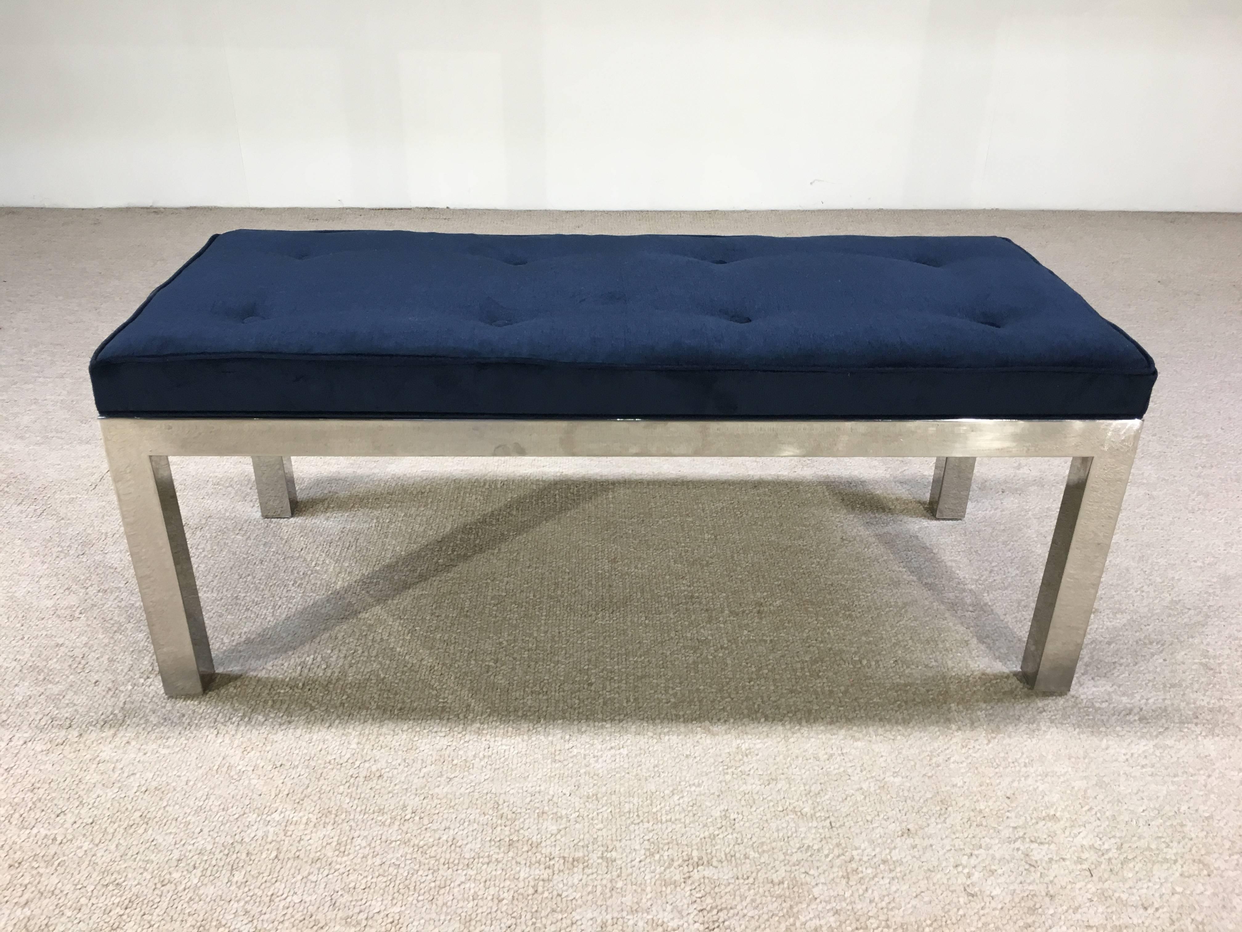 A stunning Milo Baughman bench having a squared chromed steel frame and beautiful, newly upholstered tufted velvet seat.