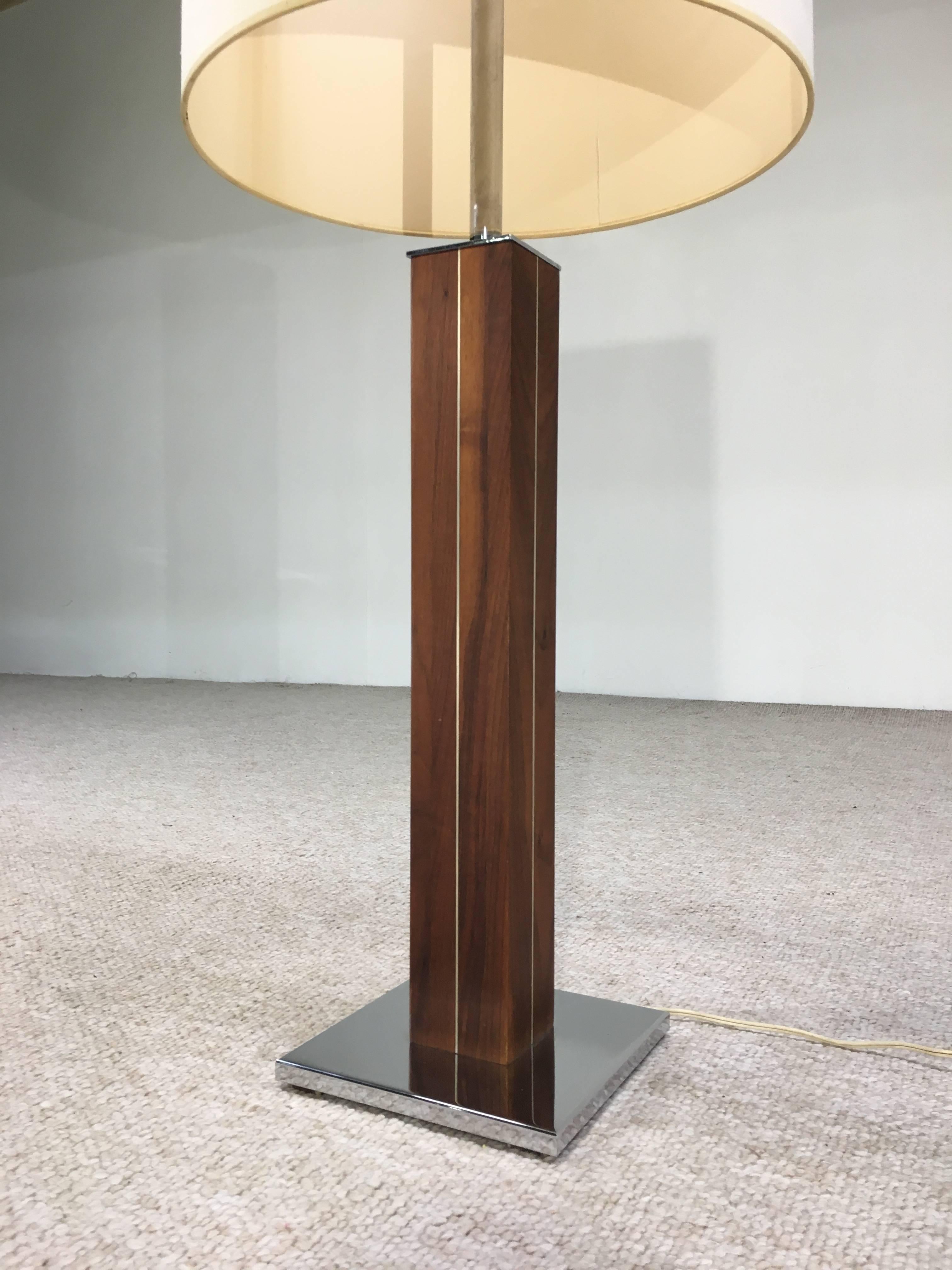 An elegant example of Nessen design having chrome accented walnut base with chrome base plate and shade arm. 
 This is the taller version of this model at 44" to shade top. 
Tested and working perfectly. Features two lights with individual