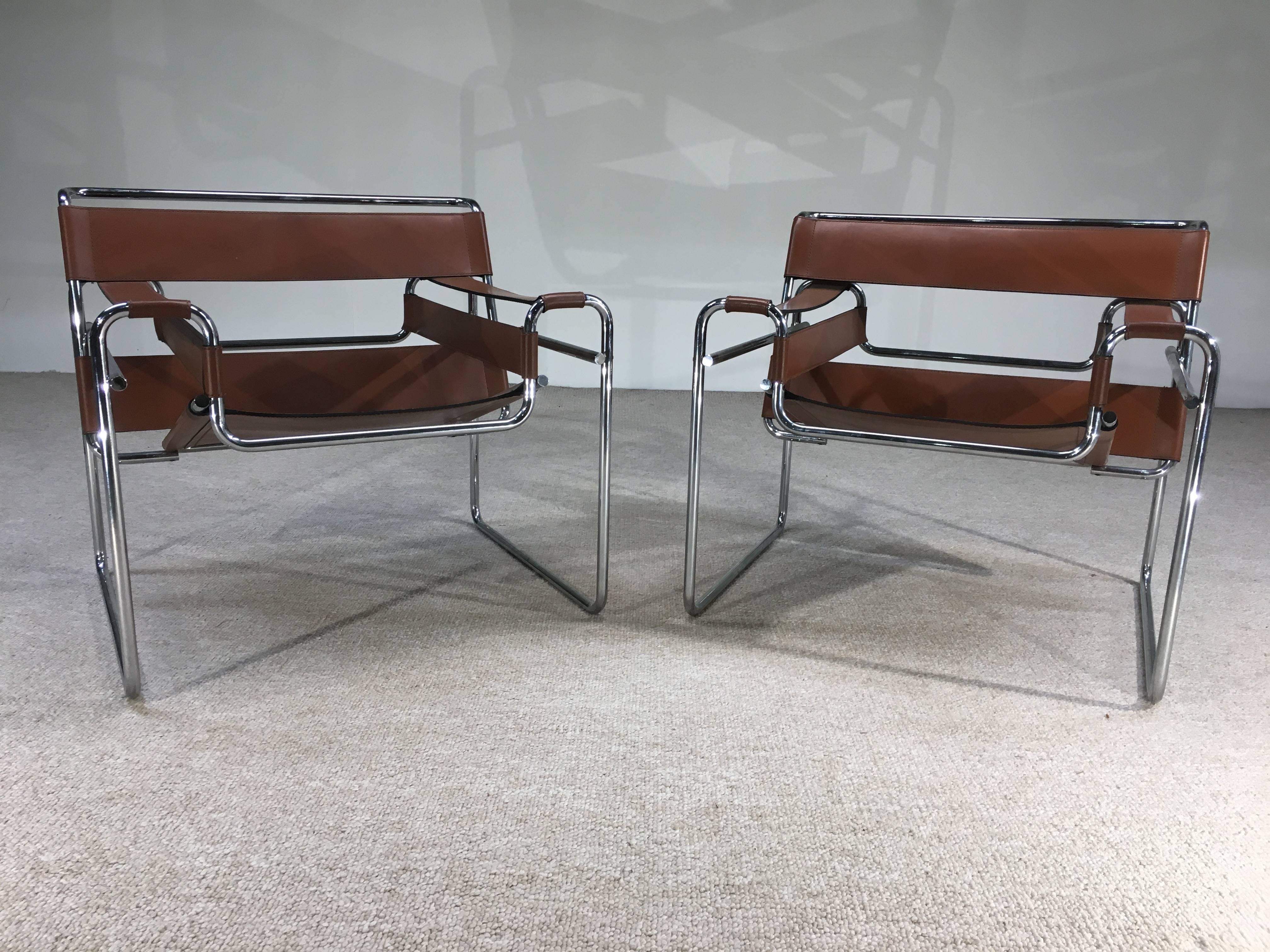 A gorgeous signed pair of Mid-Century Wassily chairs in stunning caramel leather.
Wonderful vintage condition having strong, well maintained leather and portions of the Stendig label under each. Chrome is excellent on both chairs. Ready for use!