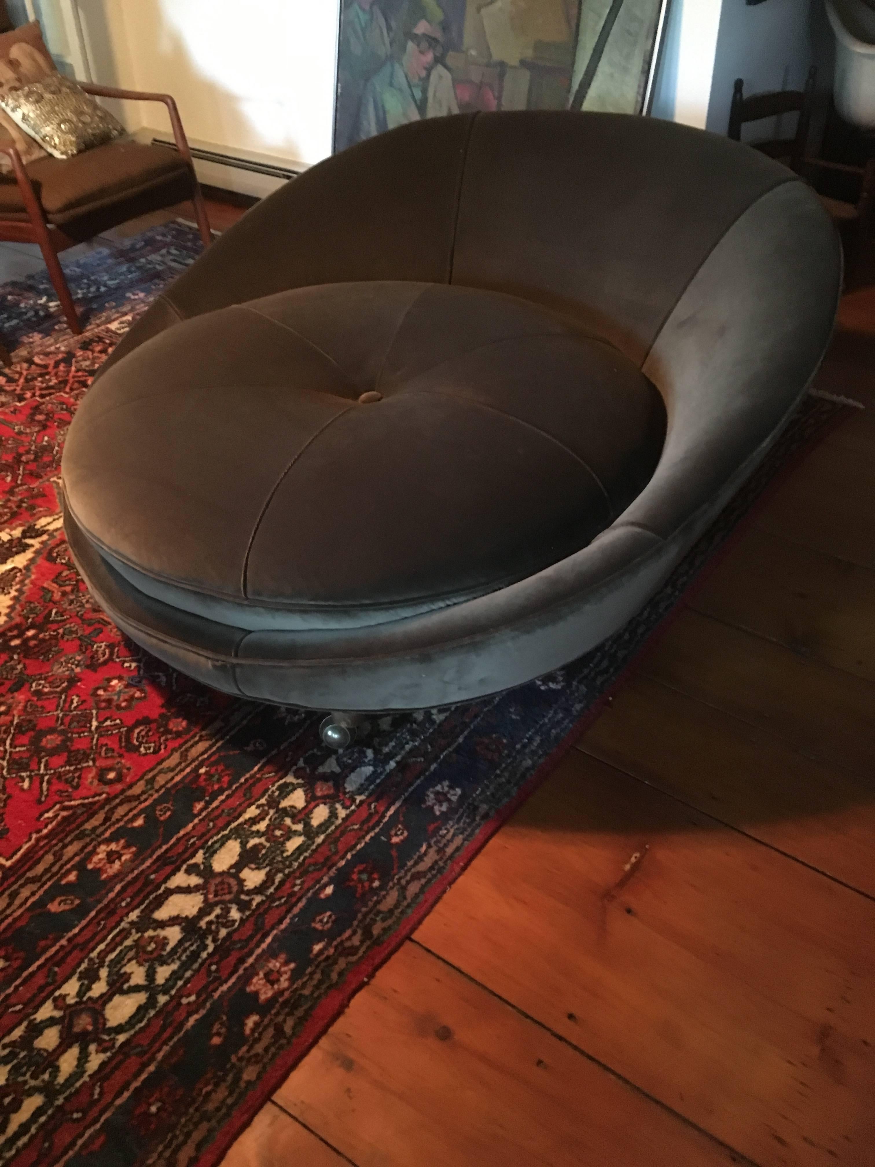 Large round lounge chair by Milo Baughman on castors.
  Newly upholstered in olive green velvet soft Mystere polyester fabric and re-stuffed.
Extremely soft and comfortable.