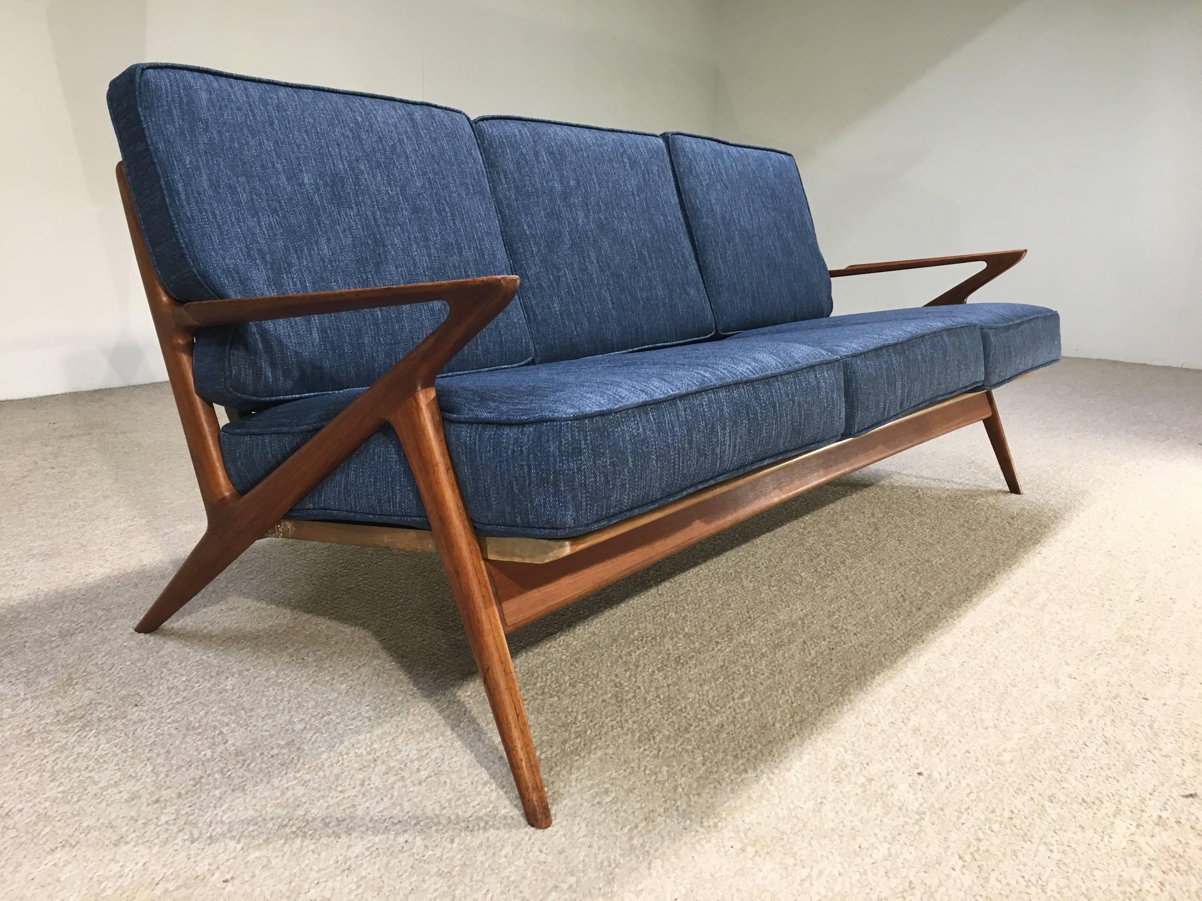 The "Z" sofa in teak by Poul Jensen for Selig, Denmark. Beautiful, stunning lines adorn one of Jensen's greatest design accomplishments.
New Fagas straps from Norway, new cushions and upholstery and beautifully maintained teak frame. This
