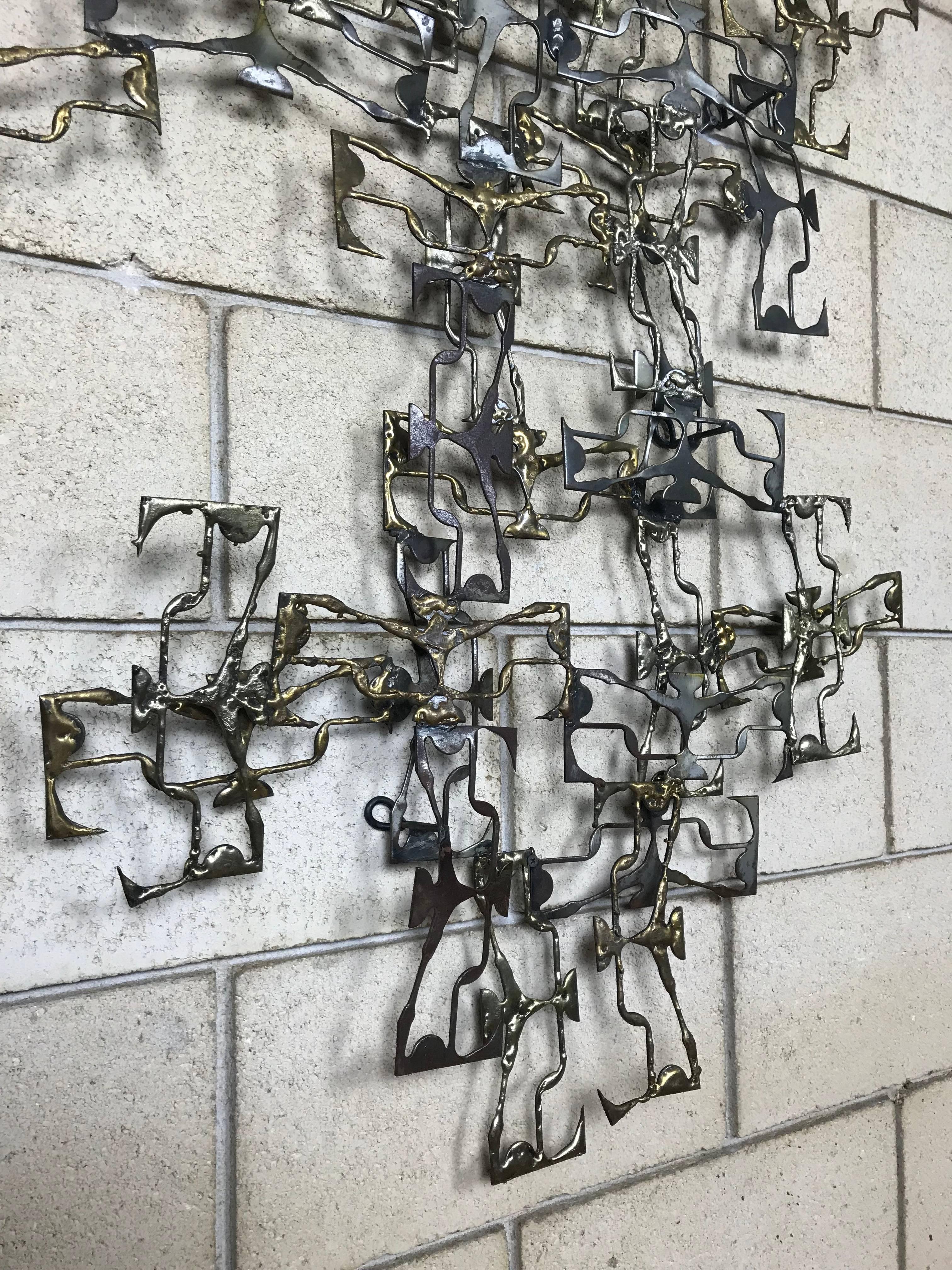 Large and impressive abstract mixed metals Brutalist wall sculpture made of brass and steel attributed to Max Levine. Unsigned. 1970s. Some oxidation to the steel parts - please see pictures. Approximate weight is 20 lbs. There are (5) loops on the