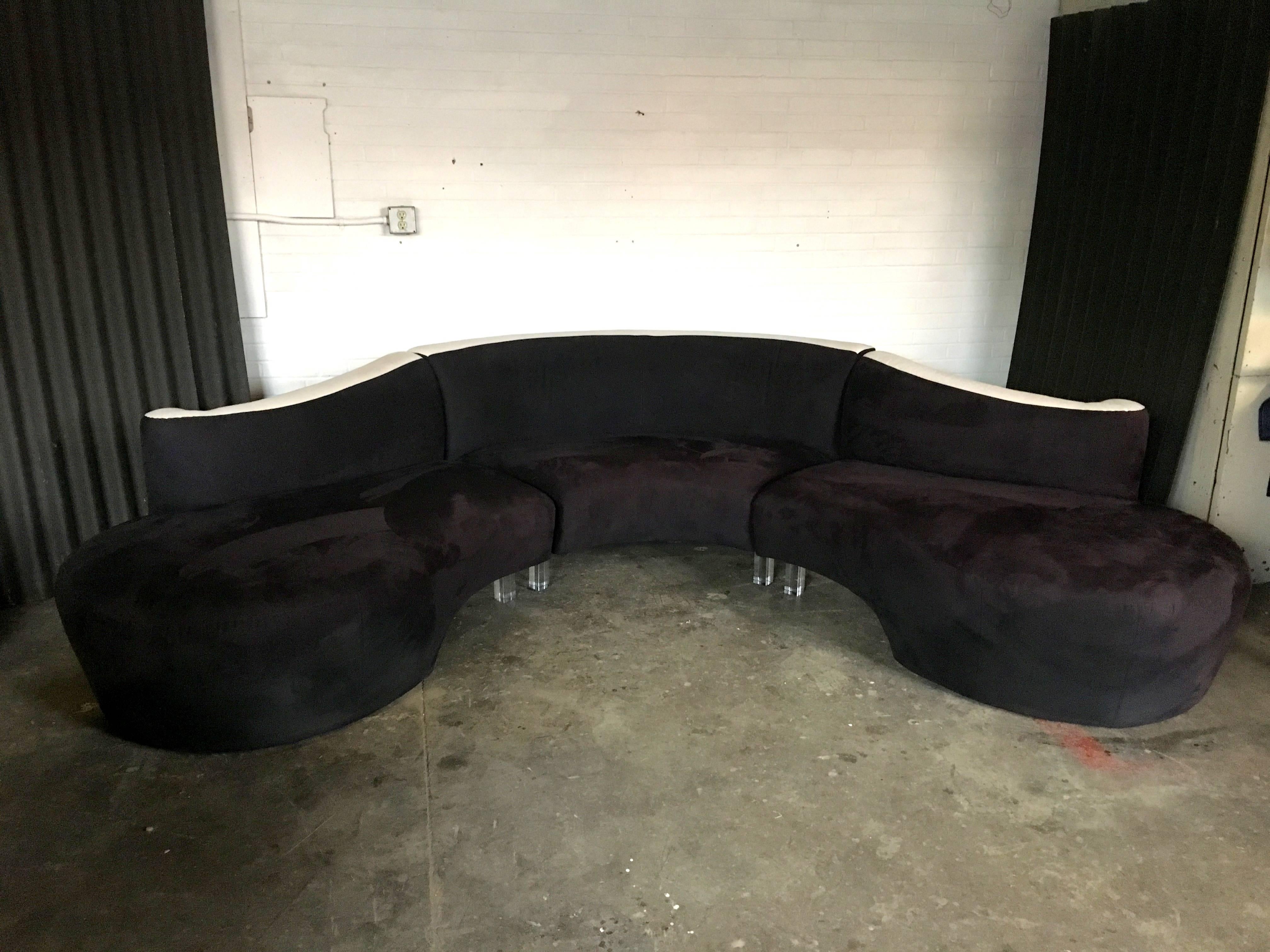 Flawless and Delicious. three-piece Serpentine sofa/sectional with Lucite Legs in the most incredible condition. A piece like this doesn't come around often and, when it does, never in this condition.
Ultra suede material in black and ivory.