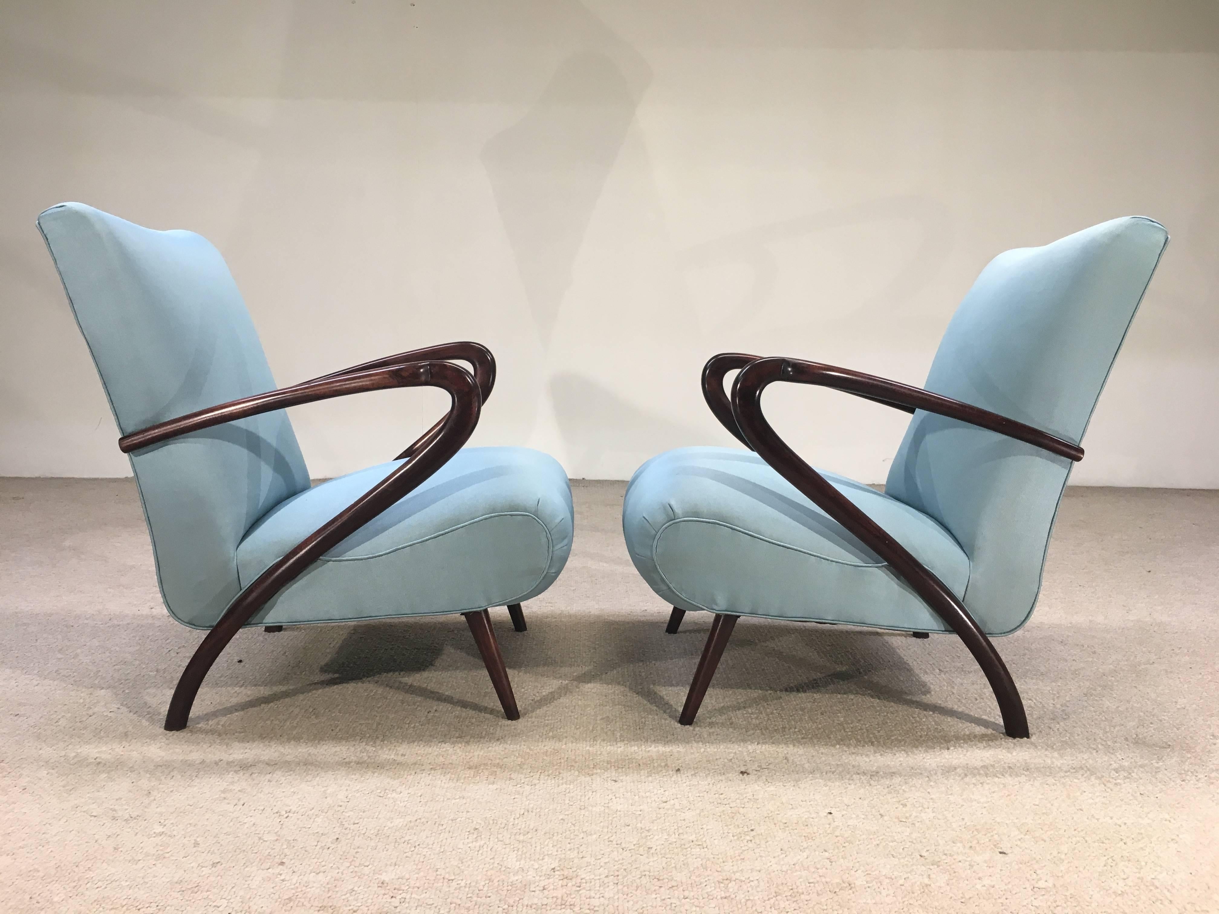 A stunning pair of authentic Paolo Buffa open armchairs having sculptural armrests. Newly upholstered in a soft, silky poly/cotton blend with the springs reset to perfection, Italy, circa 1947
Solid, sturdy, ready for use. 
Seat height 16
