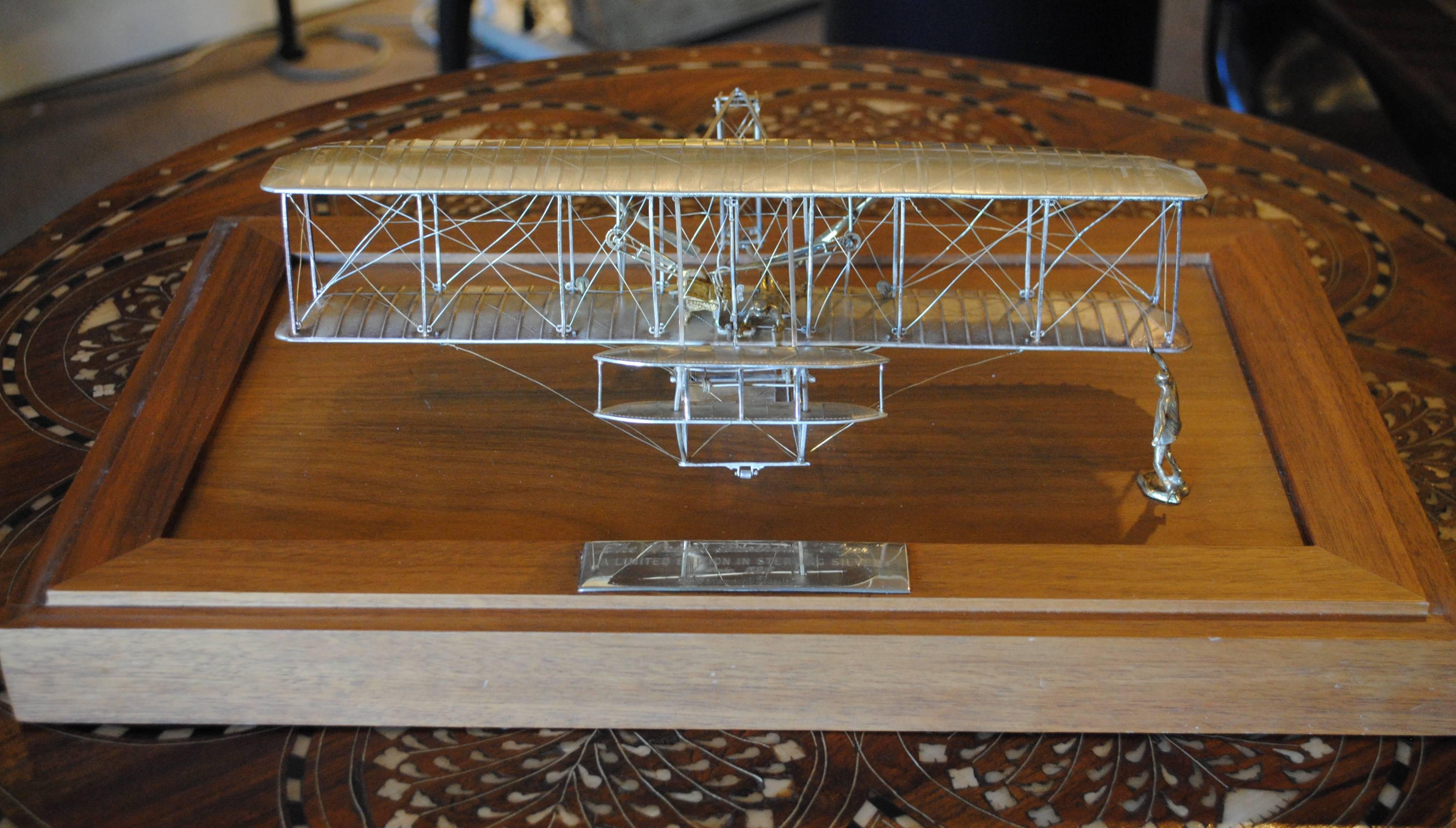 This is a scale model of the famous Wright Flyer, which made the first powered flight at Kitty Hawk in 1903. It is detailed and meticulously recreated in sterling silver. 526 of 1000 edition by Paramount Classics. Dimensions of flyer: 12.5
