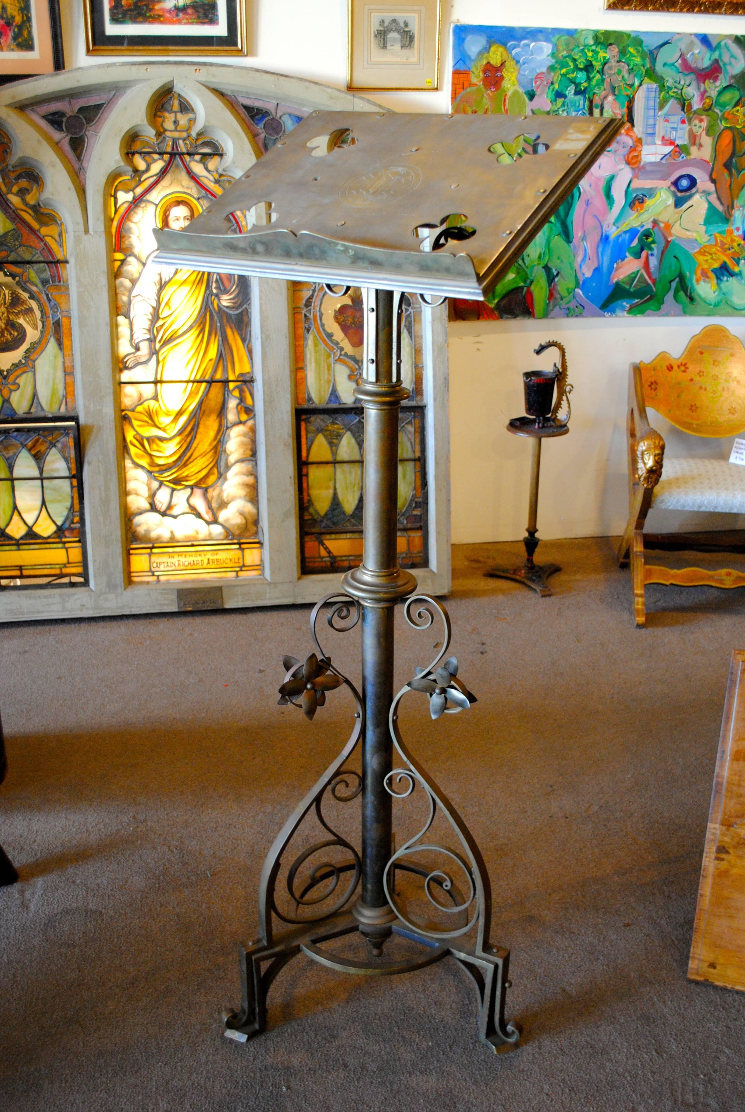 Highly original and unique bronze lectern, could also be used as a music stand. Decorated with flowers and scrollwork.  Made by Jones & Willis.