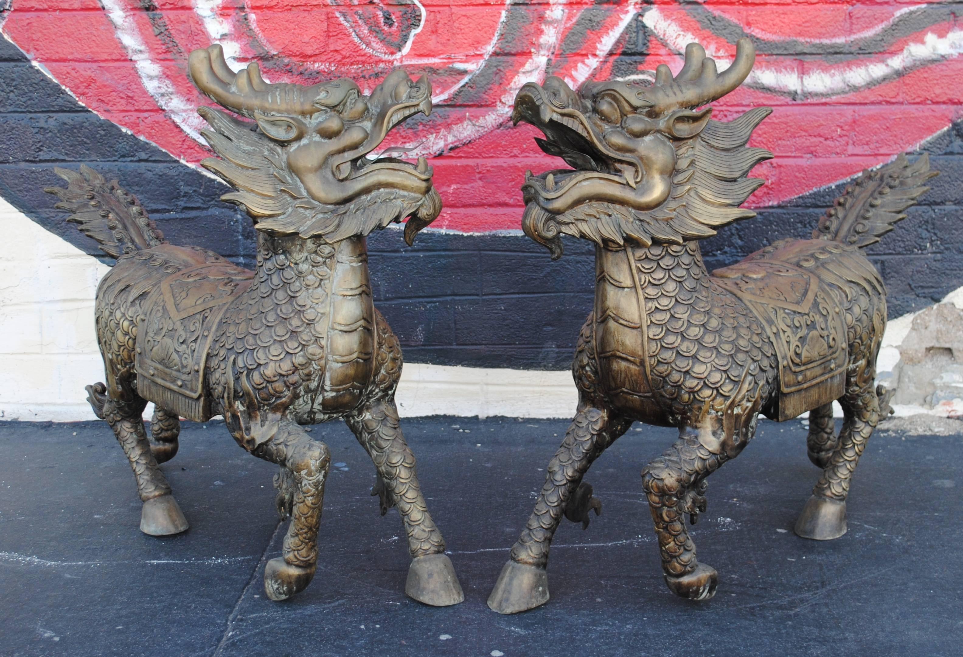 Pair of large bronze Chinese foo dragons. Measures 33.5