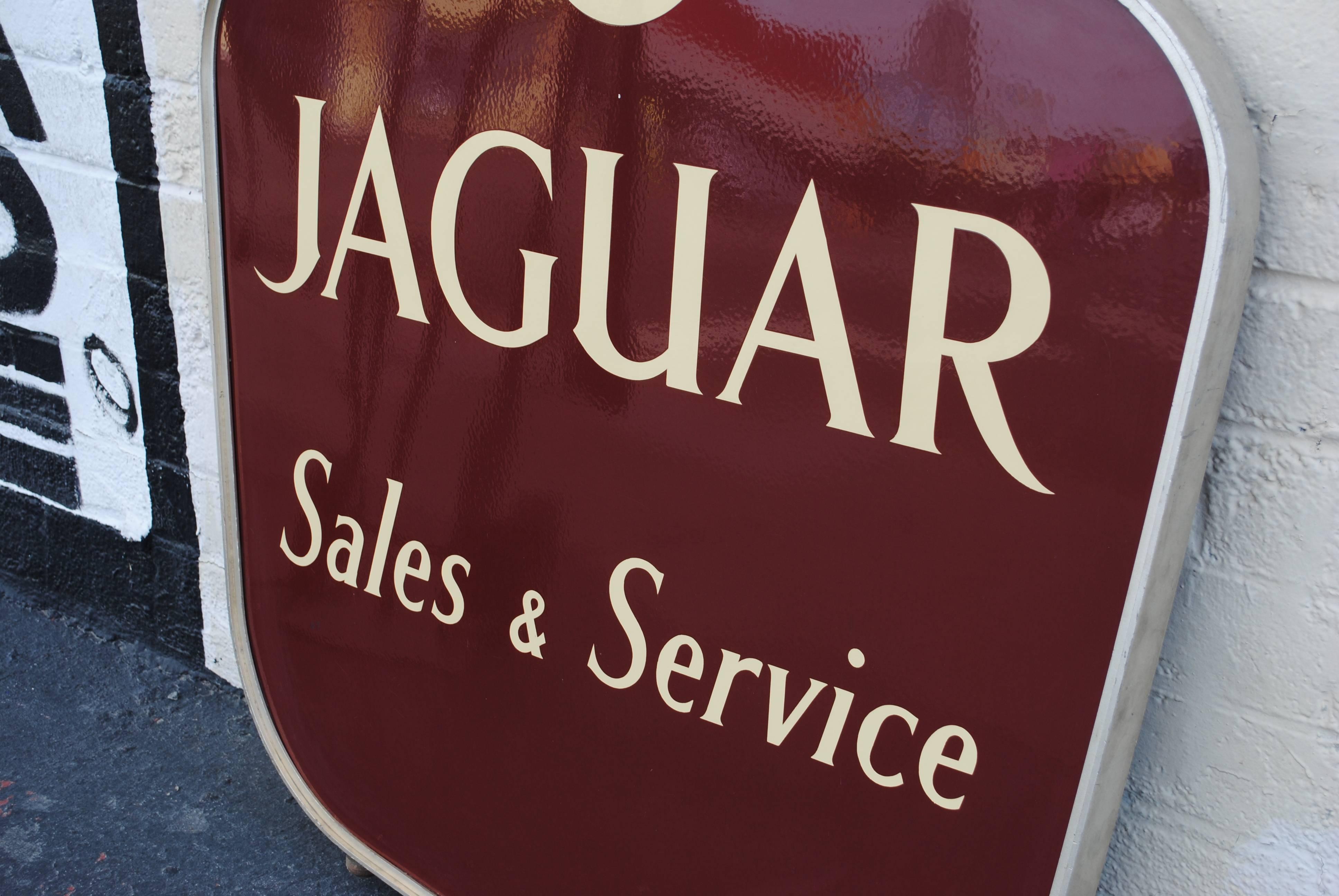 Jaguar sales and service double-sided porcelain dealership sign. Complete with top hangers and 2