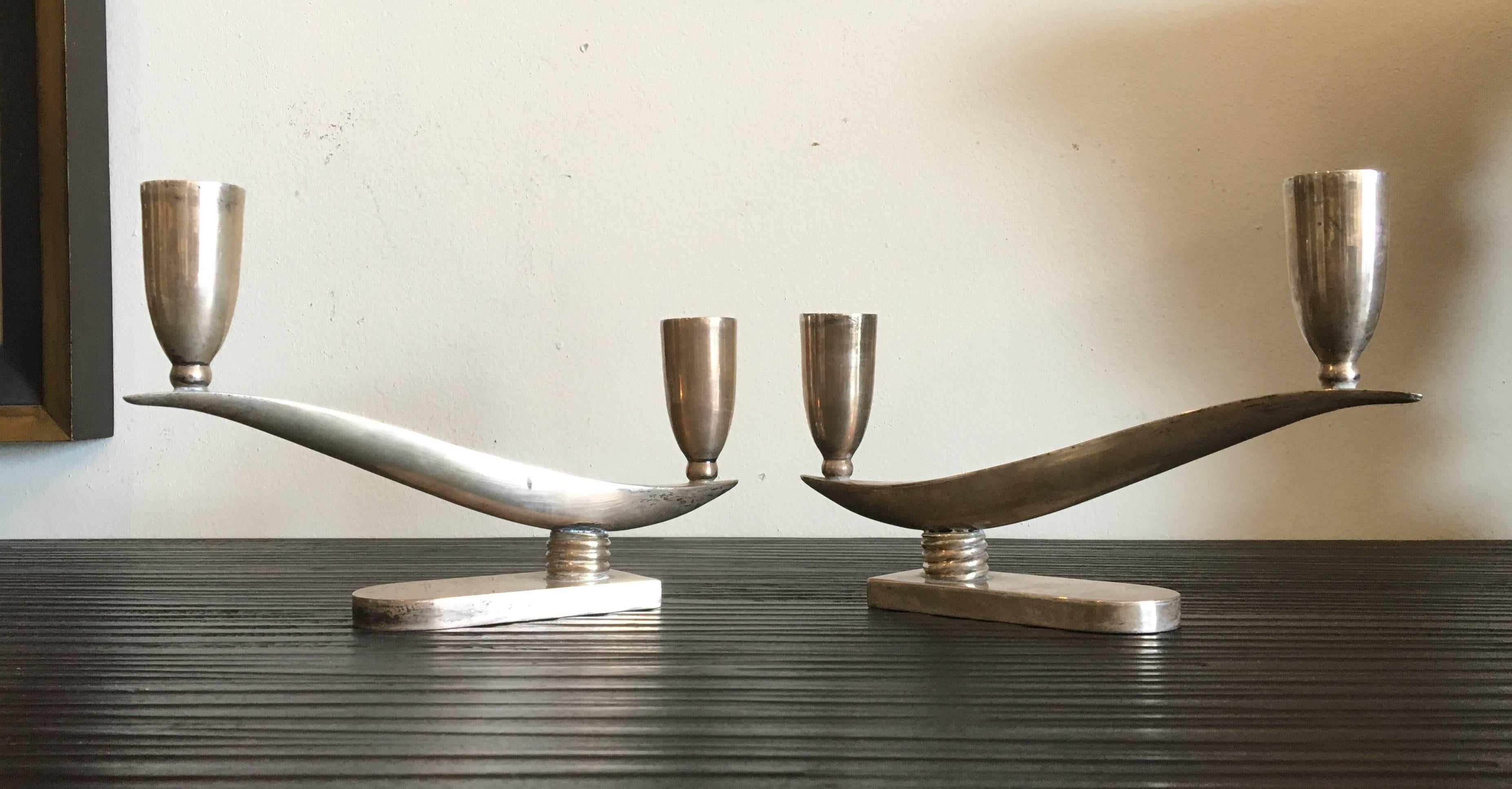 A beautiful pair of vintage Mexican sterling silver modernist candleholders. The measurement of each candleholder is 9 1/4