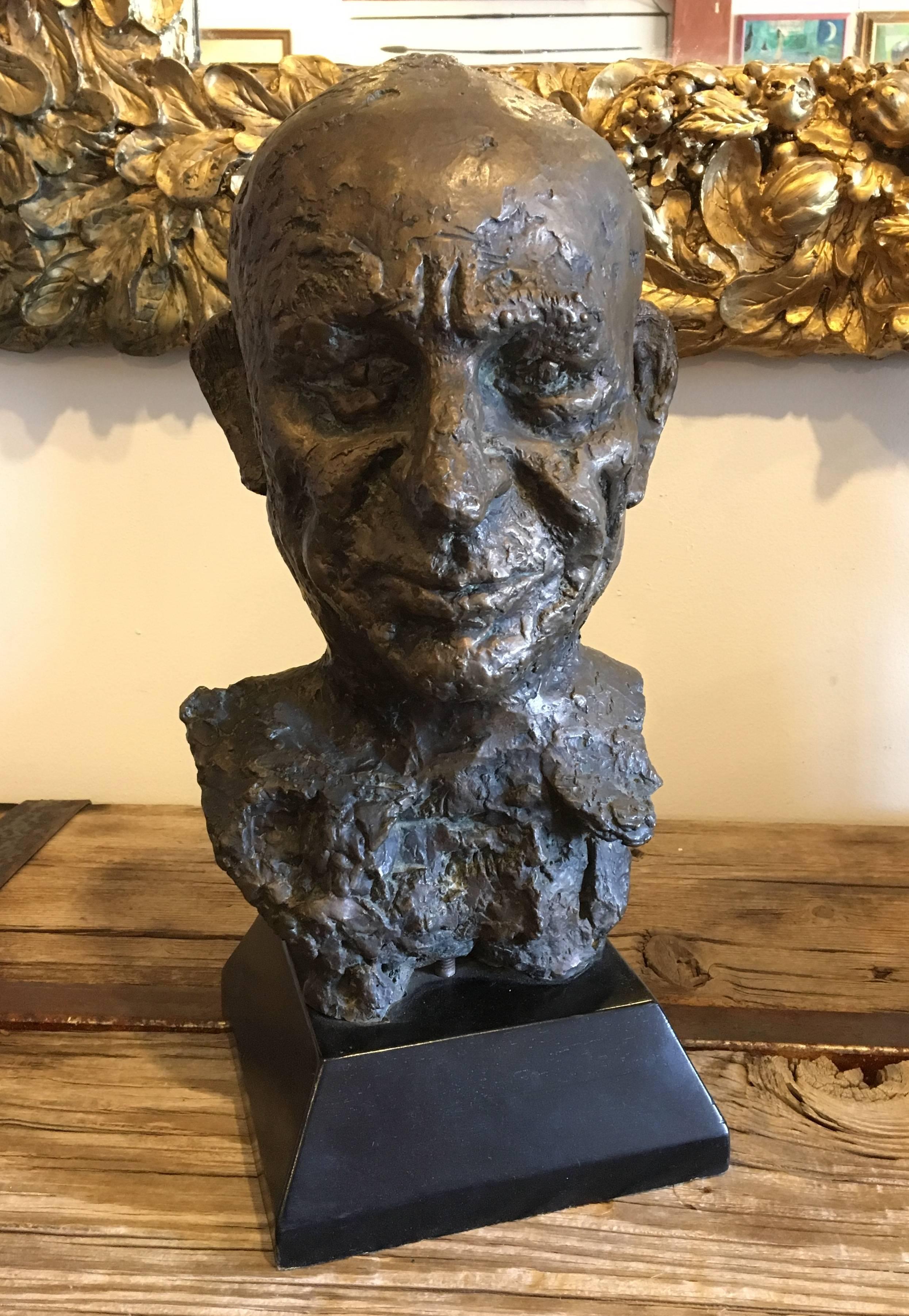 Offering this bronze bust of a man with an unusual, strong face. Overall dimensions: 19