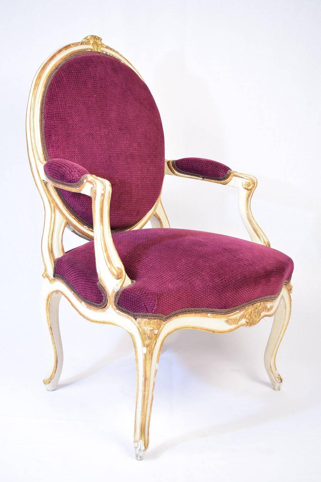 Set of six velvet upholstered pained and gilt wood Transition style armchairs with oval backs and bowed seats on cabriole legs. France, 18h Century. 

The Transition style, corresponds to the first part of the Louis XVI style in the French