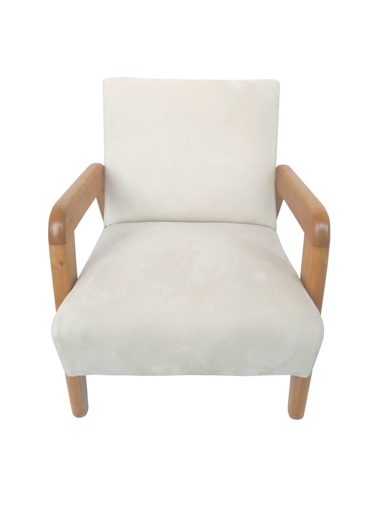 These exceptional mid-20th century armchairs are newly reupholstered in an ecru-white leather. Their arms and legs are rock maple wood. Similar to Edward Wormley's Classic Dunbar designs, the structure of these chairs is distilled to minimal shapes